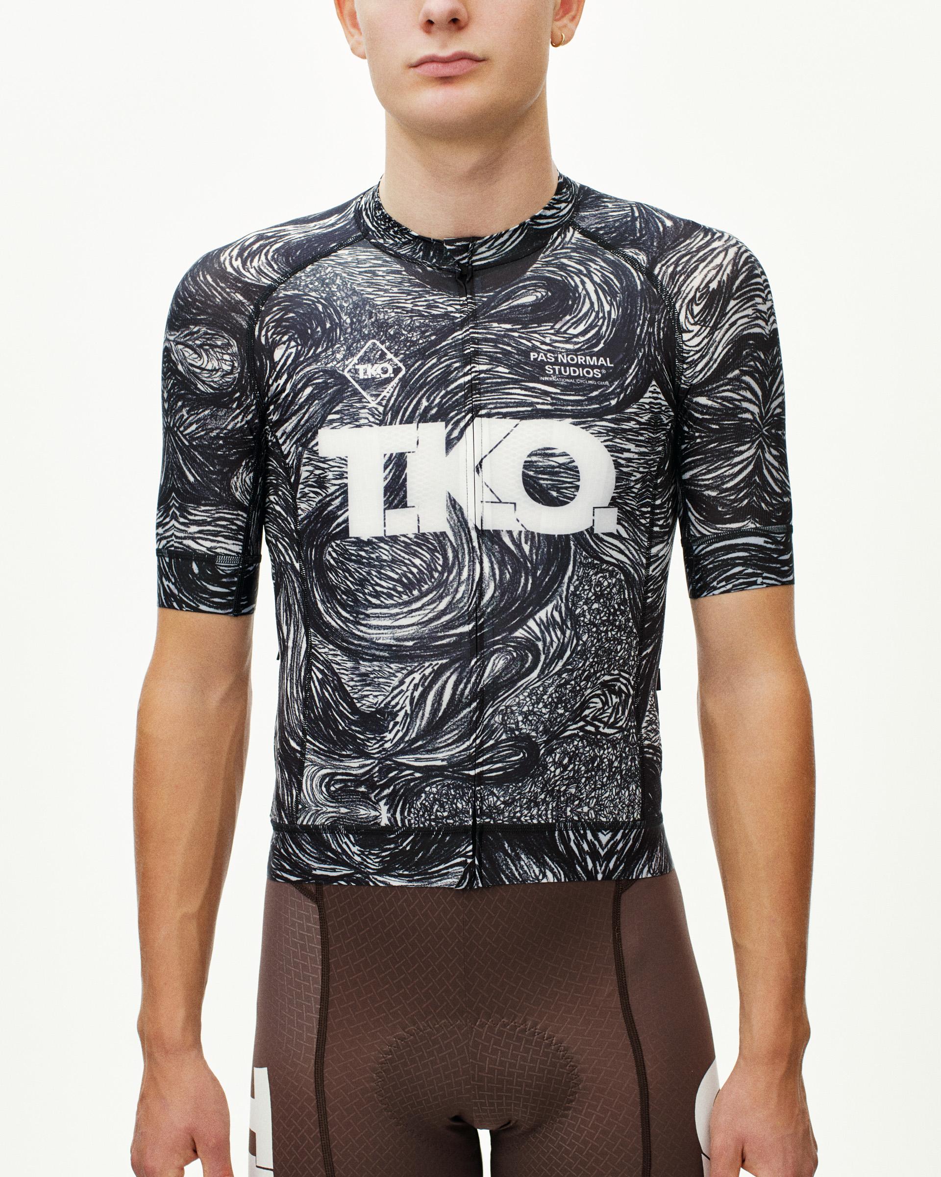 Iron Grey T.K.O. Mechanism cycling jersey on model, front view with swirling black and white all-over print