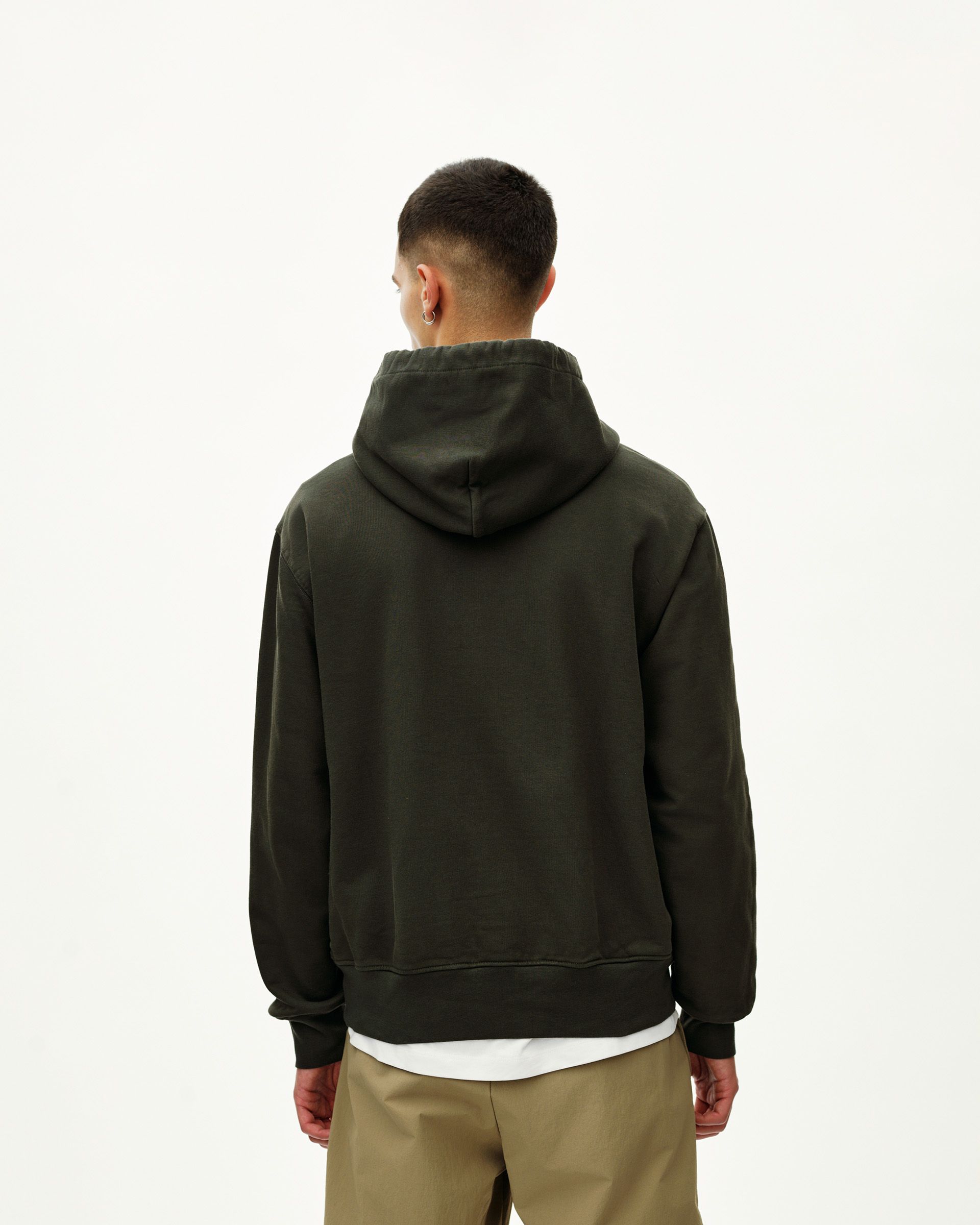 Dark Olive Off-Race hoodie on model, rear view with ribbed cuffs and hem