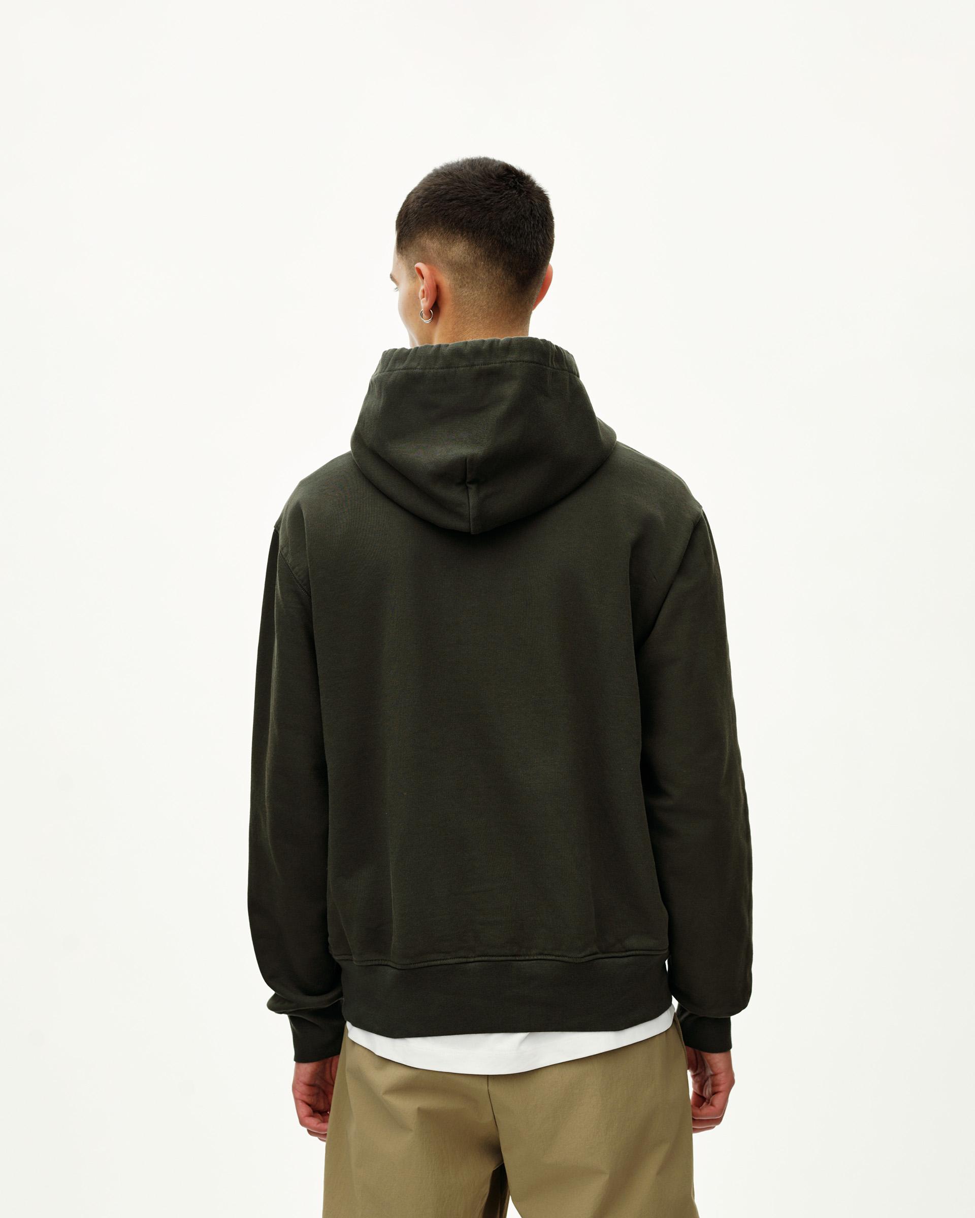 Dark Olive Off-Race hoodie on model, rear view with ribbed cuffs and hem