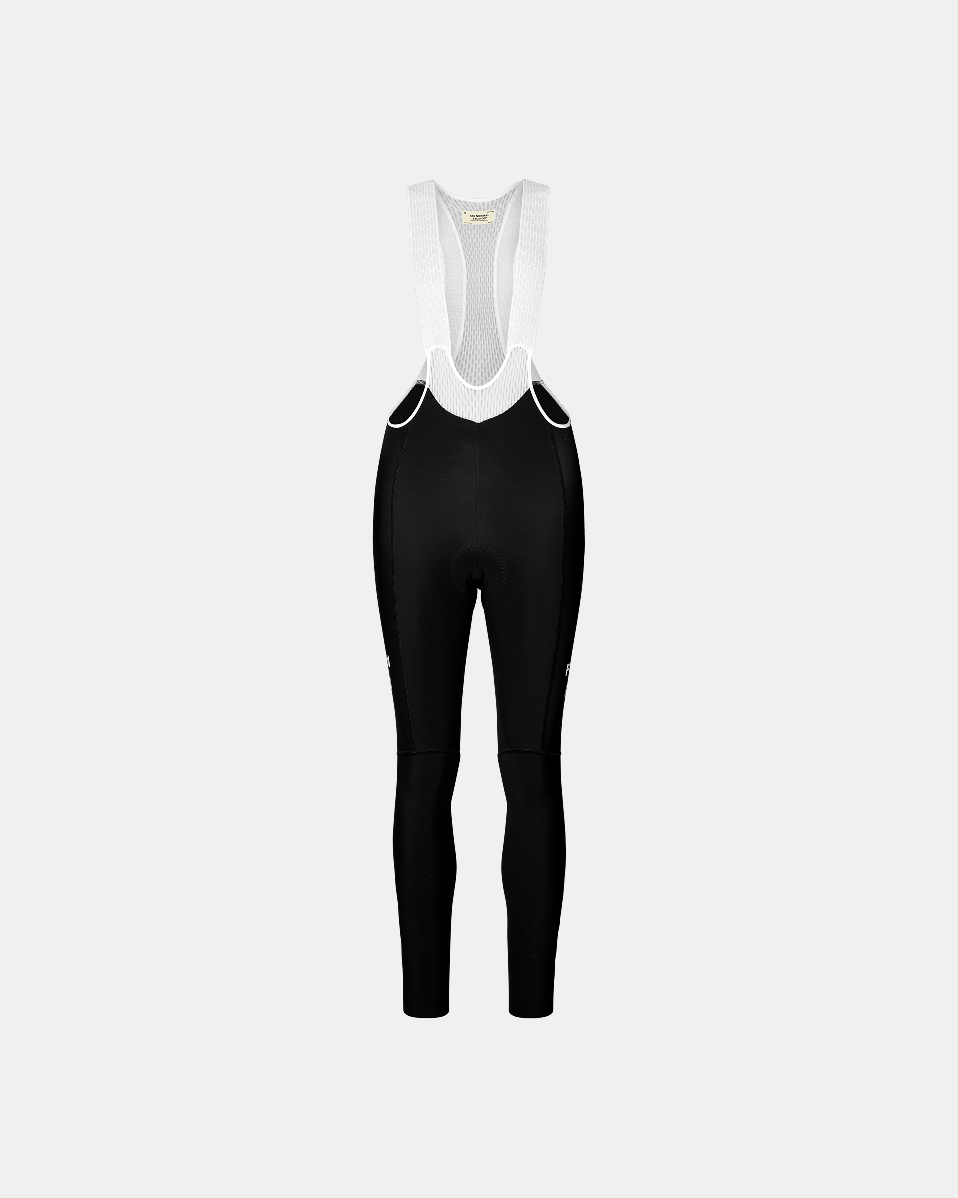 Black Mechanism women's thermal cycling bib tights, front flat lay with white mesh bib straps