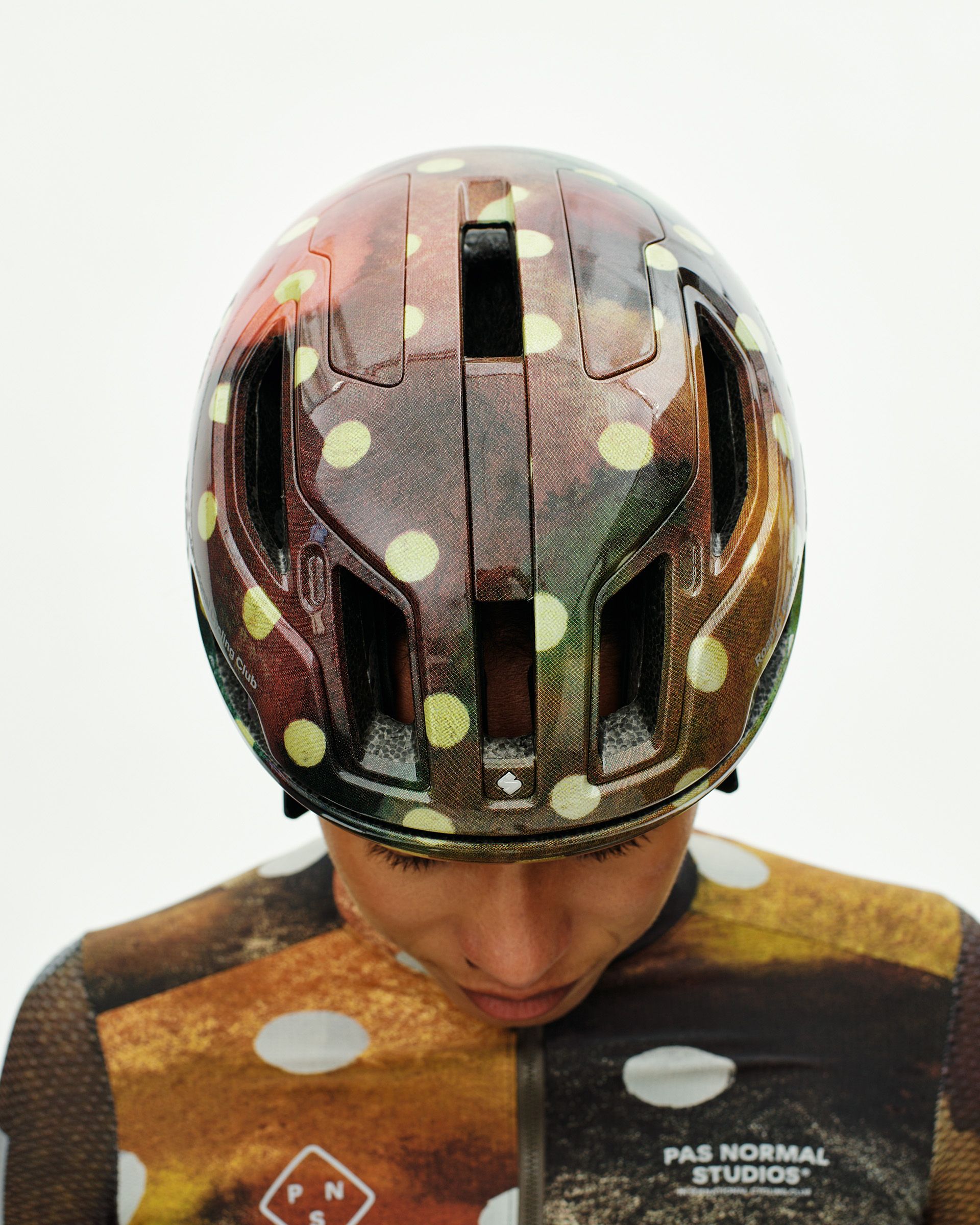 Brown T.K.O. Falconer Aero 2Vi helmet on model with yellow polka dot pattern