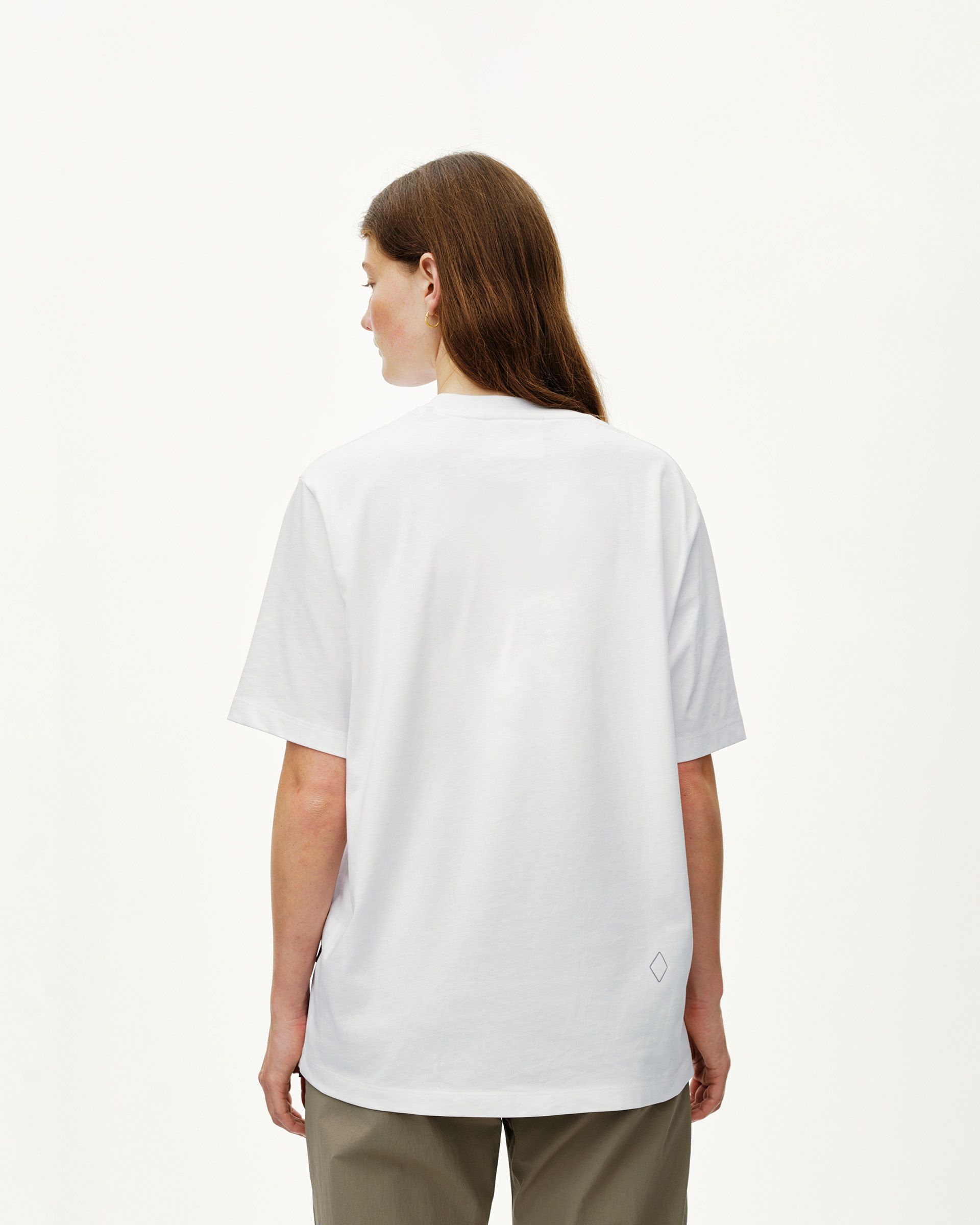 White Off-Race T-shirt on model, rear view with small diamond logo at hem