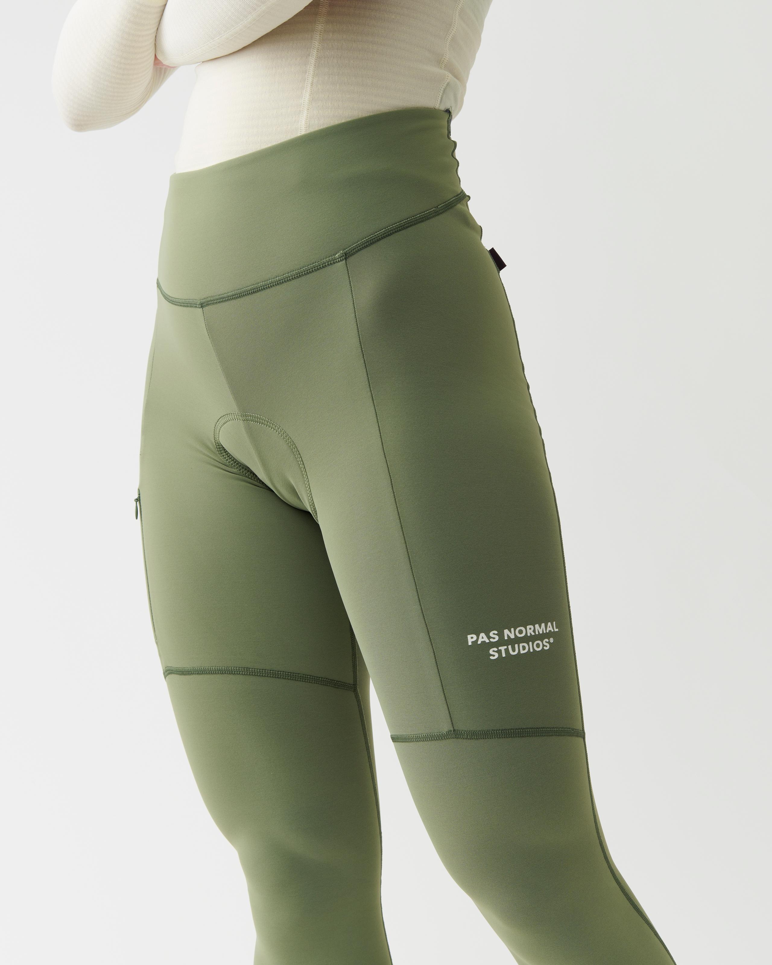 Green Essential Thermal Long cycling tights on model with chamois pad and white leg branding