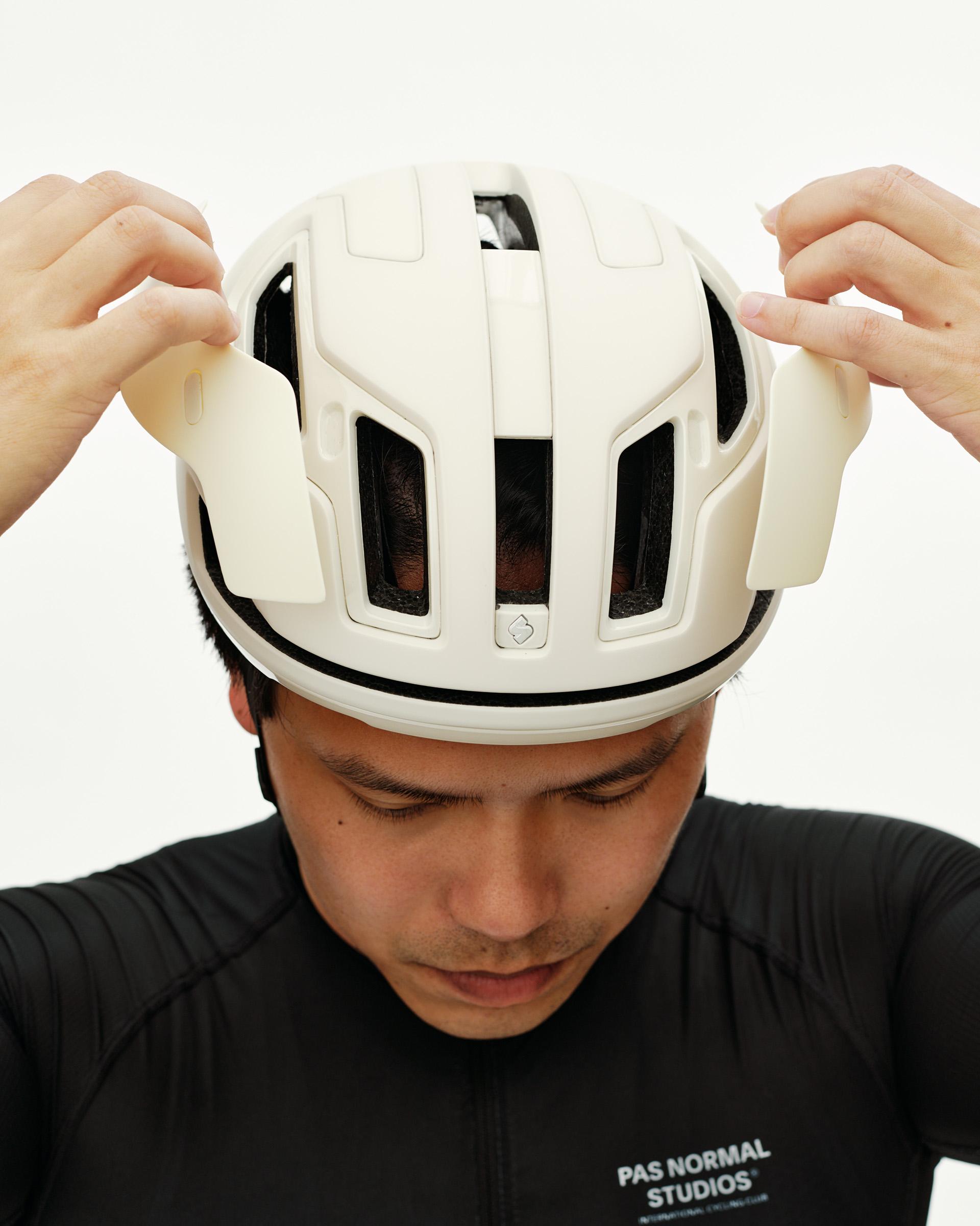 Off White Sweet Protection Falconer Aero 2Vi cycling helmet on model, top-down view with vented shell