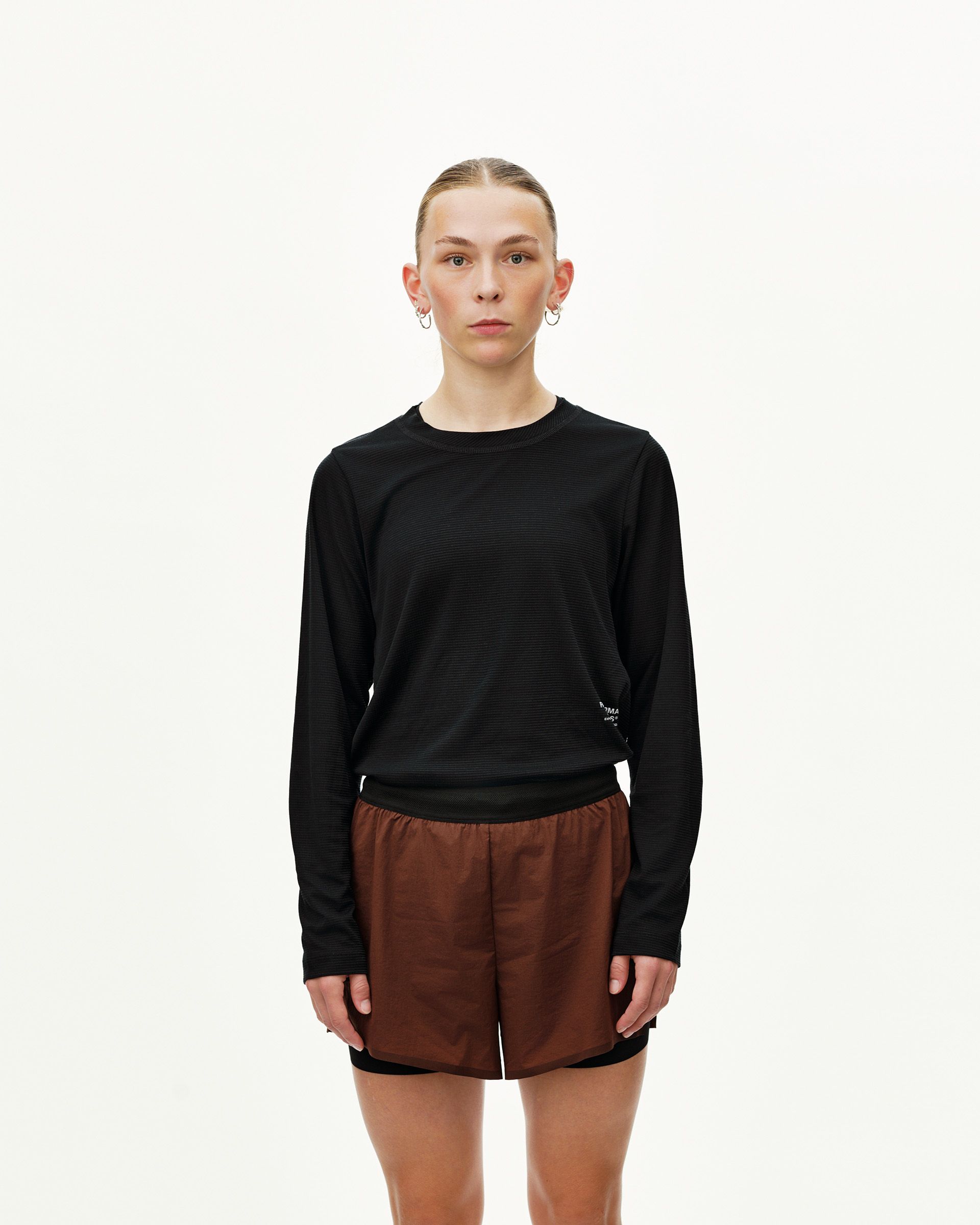Maroon Brown Balance 2-in-1 shorts on model, front view with black inner layer visible