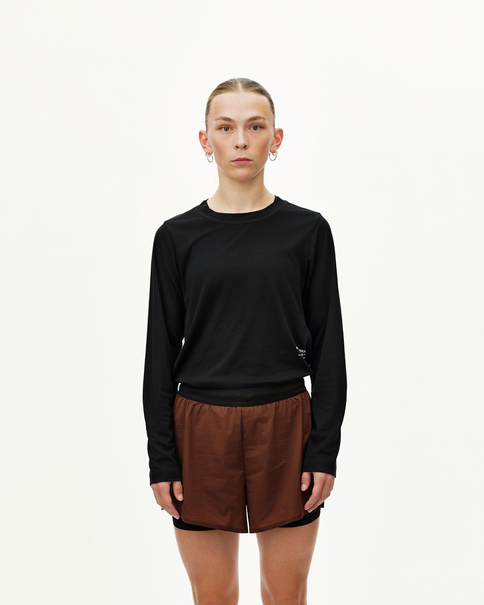 Maroon Brown Balance 2-in-1 shorts on model, front view with black inner layer visible