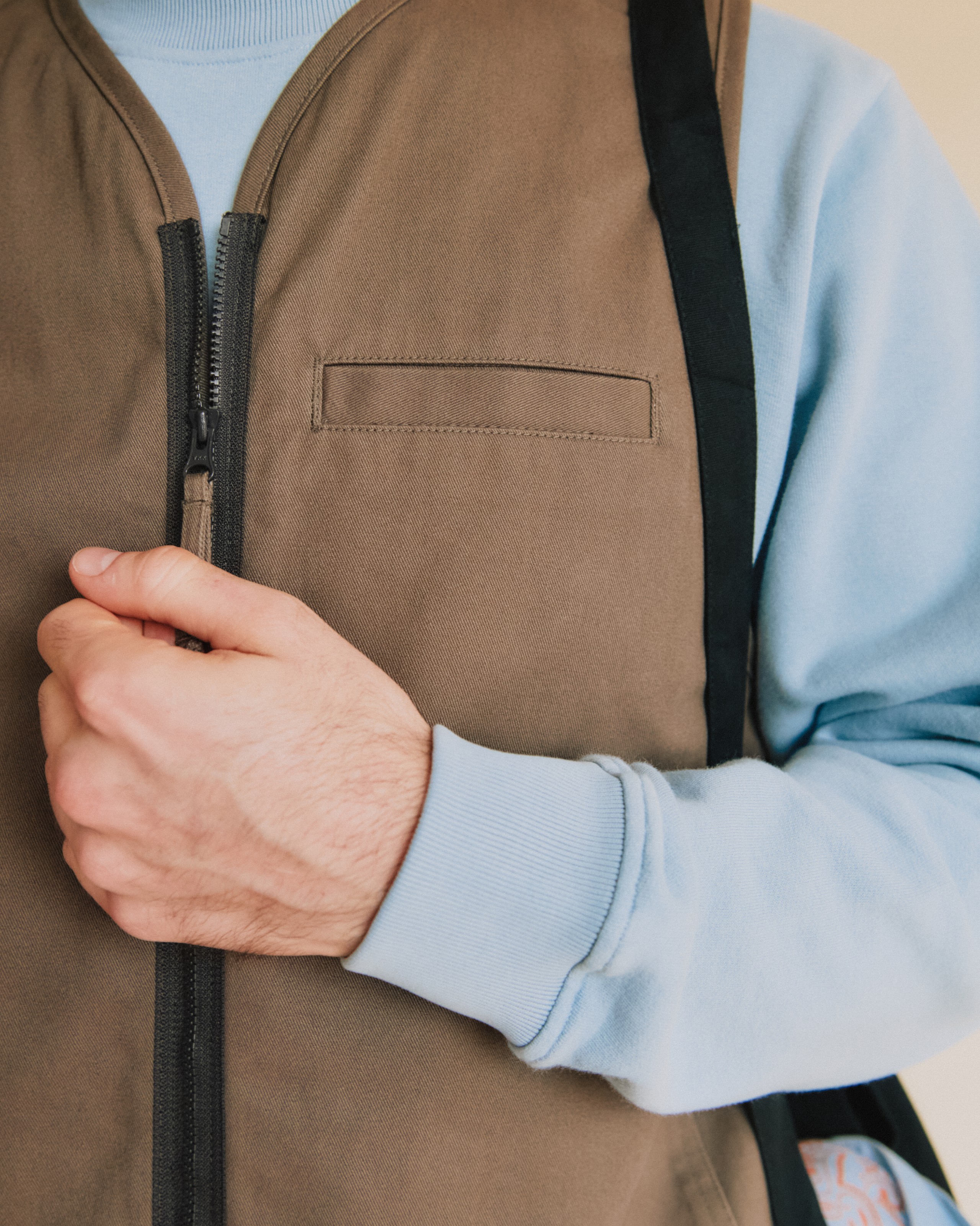 Two-way front zipper with cotton pulls for adjustable ventilation and access to inner layers