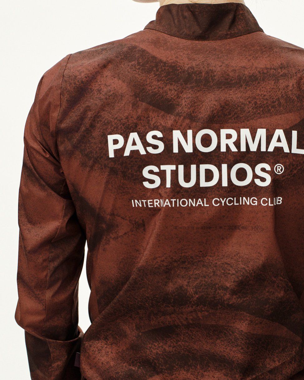 Brown Mechanism Stow Away jacket, rear view with white logo print