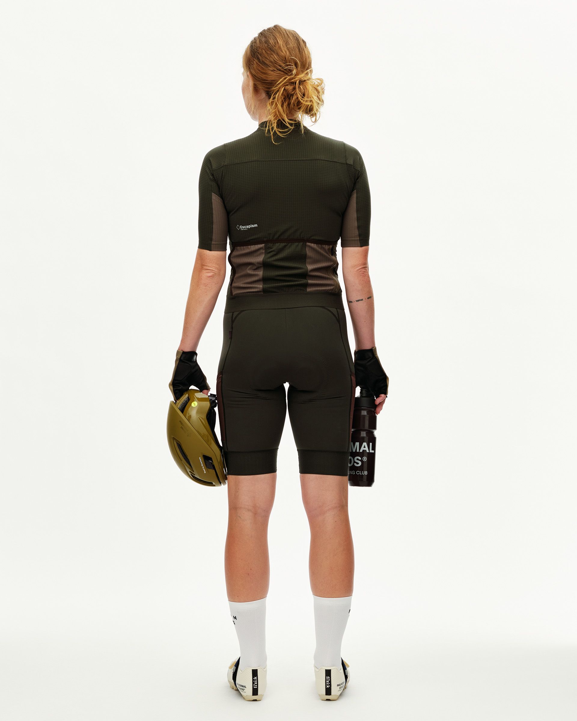Dark Olive Escapism women's cycling jersey, rear view on model with back pockets and contrast panel detail