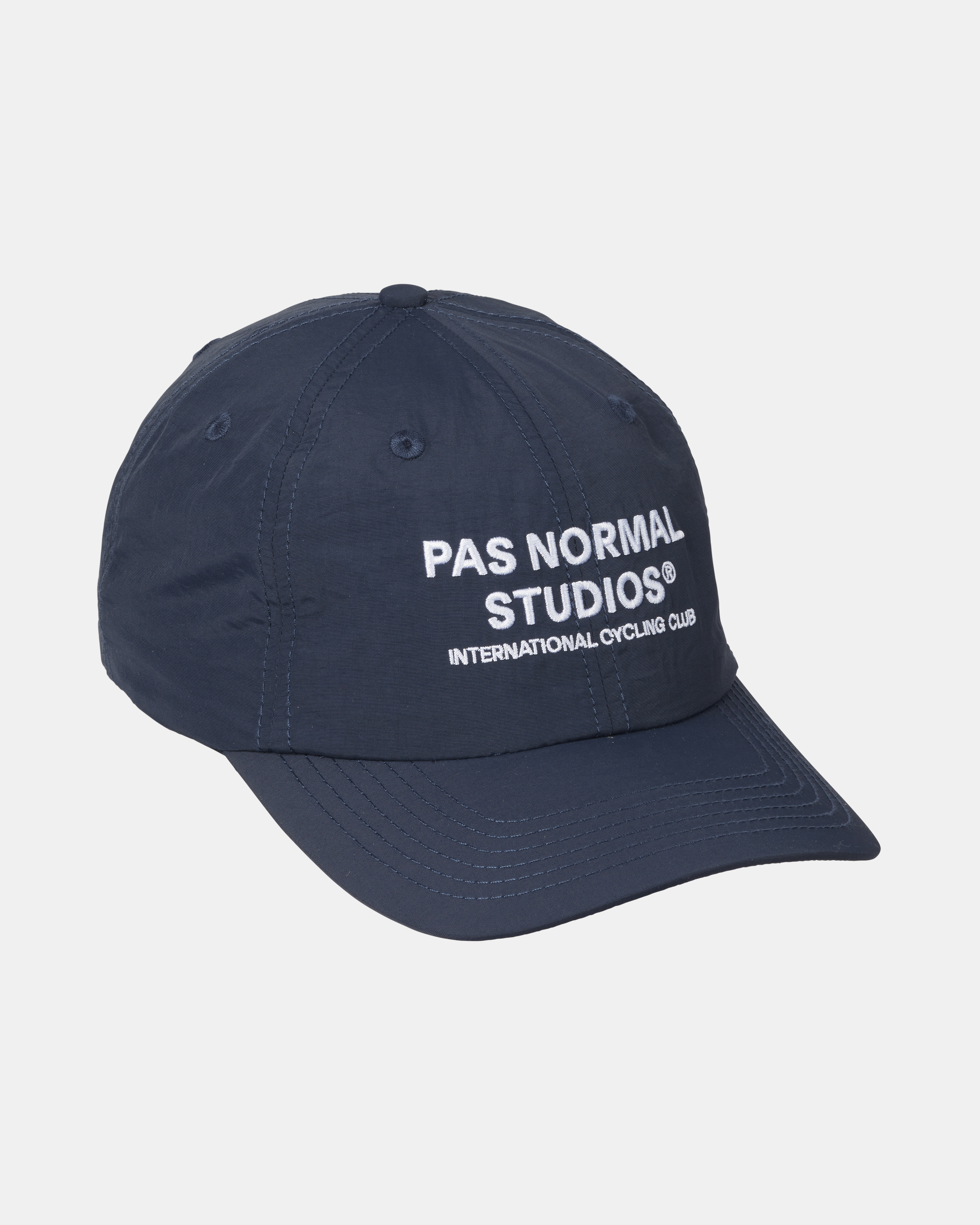 Navy Off-Race cap, three-quarter view with white embroidered logo and contrast stitching