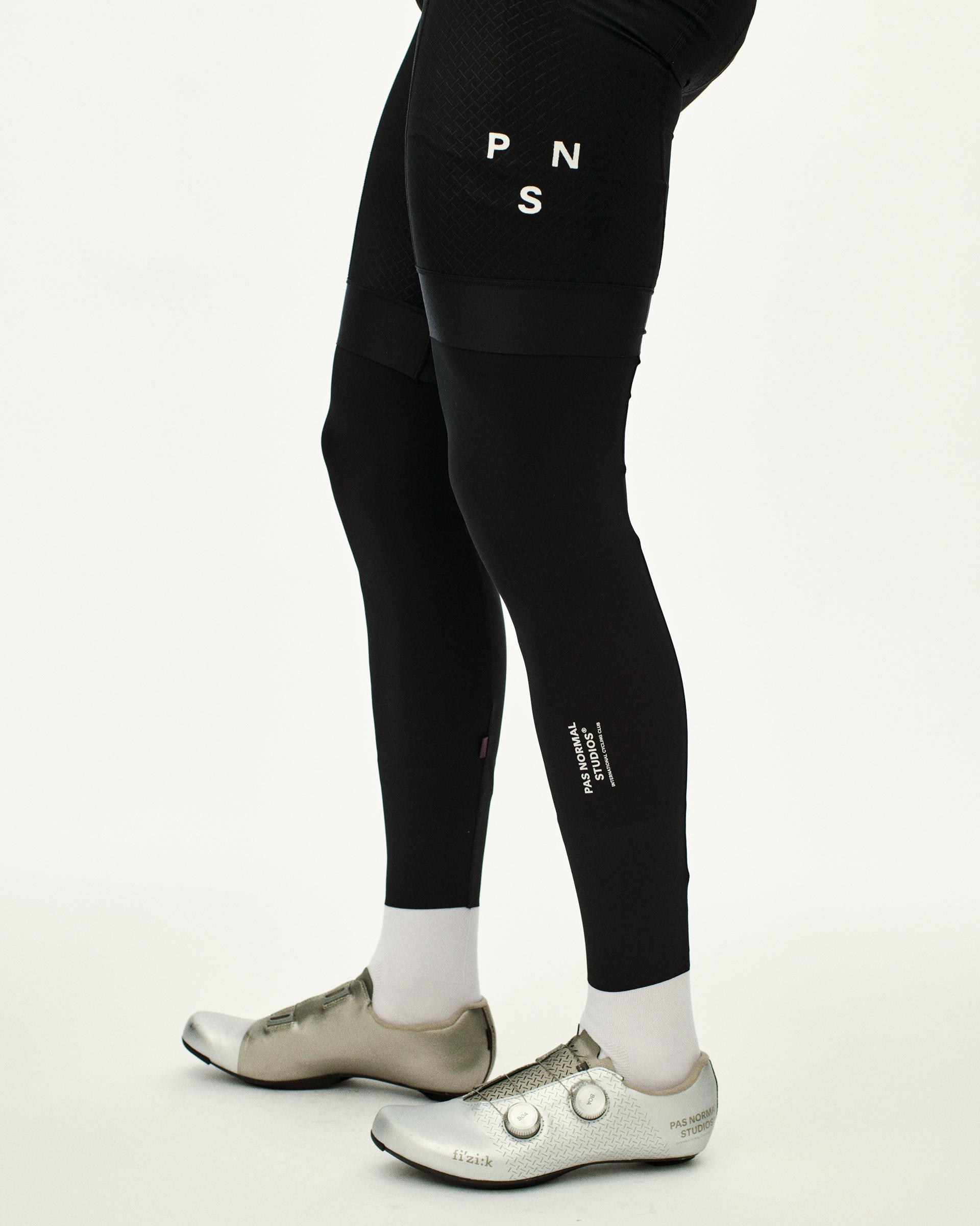 Black Logo Leg UV cycling leg warmers on model with white PNS logo print