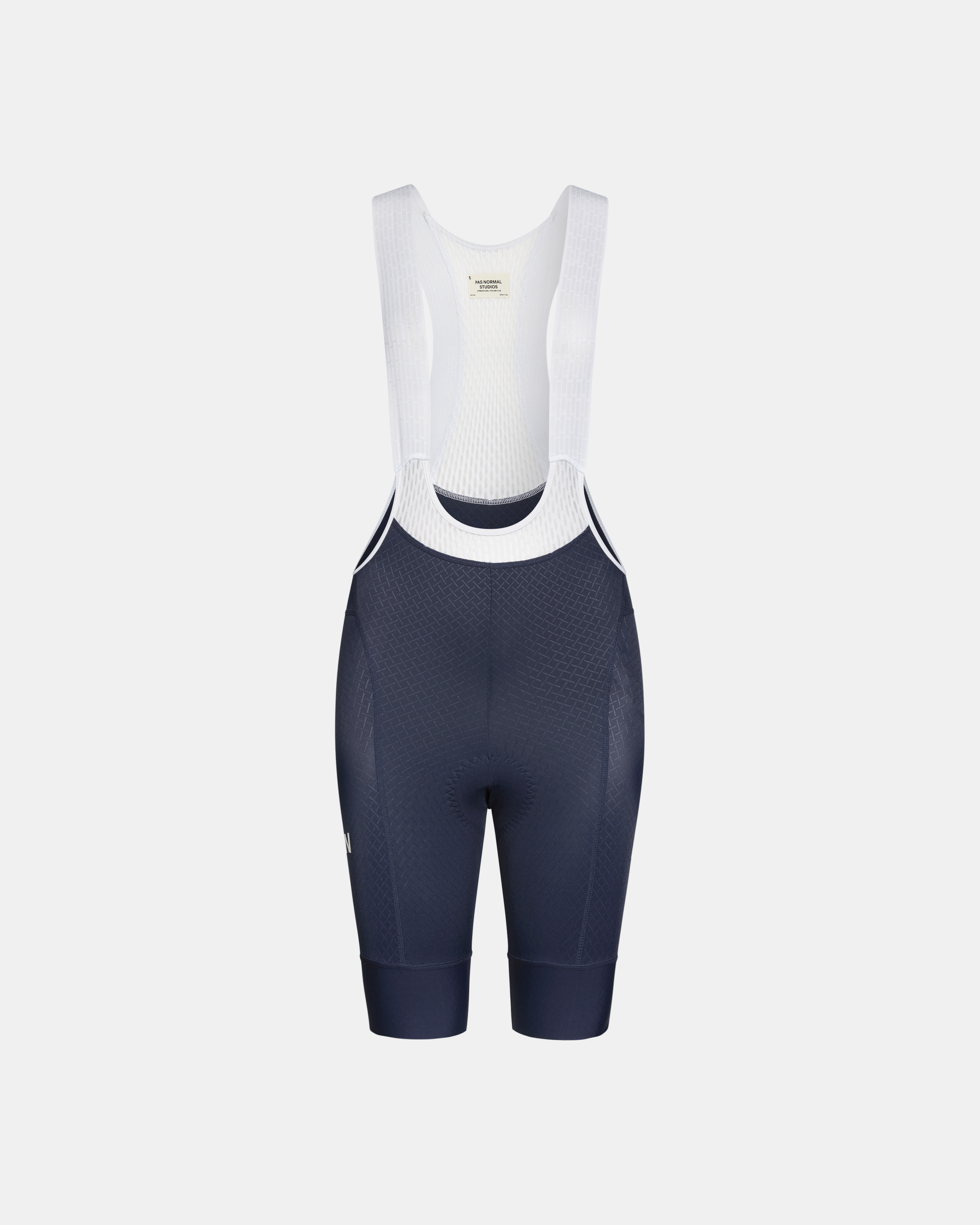 Navy Mechanism cycling bibs, front flat lay with white mesh bib straps