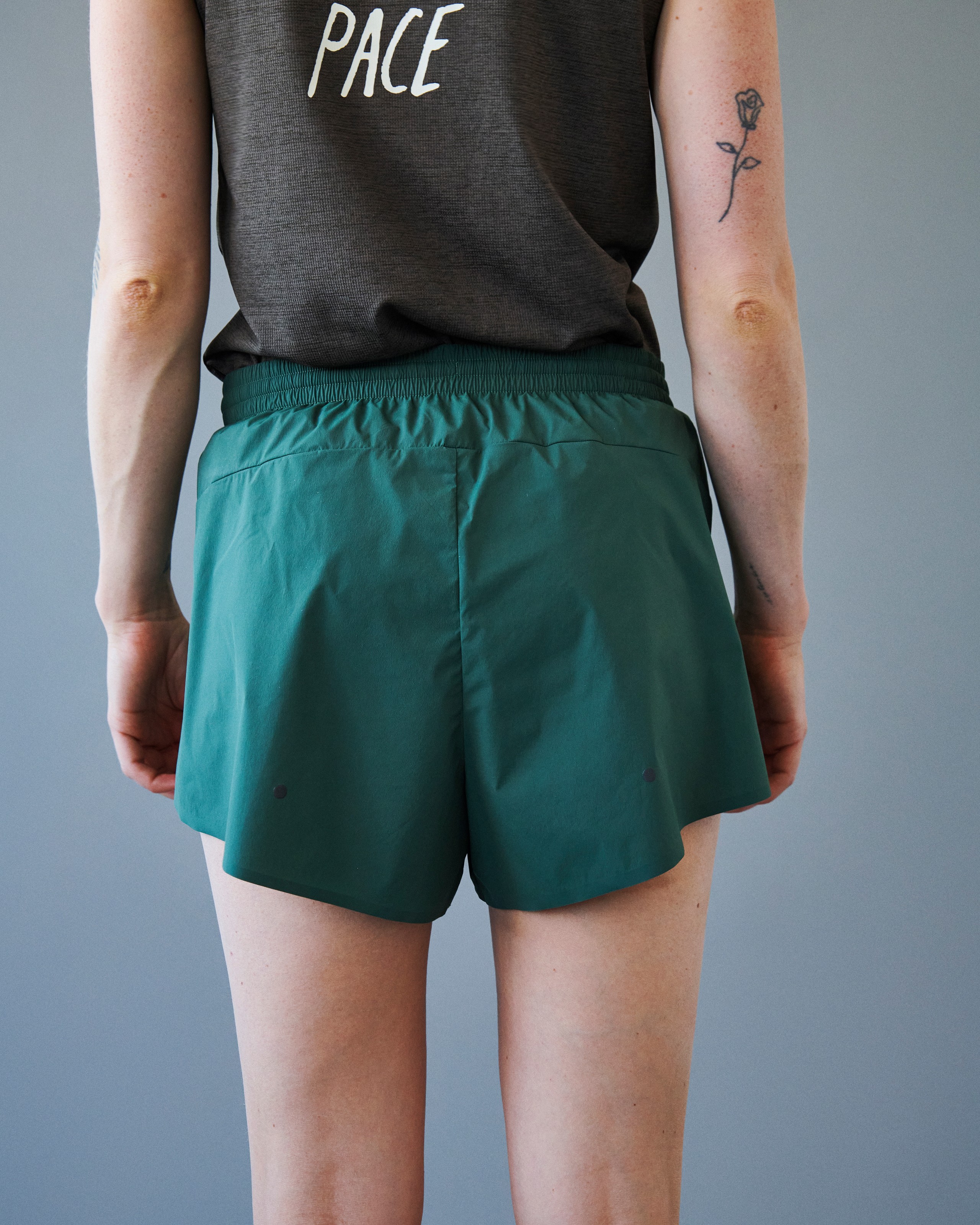 Forest Green Balance women's shorts, rear view on model with elastic waistband