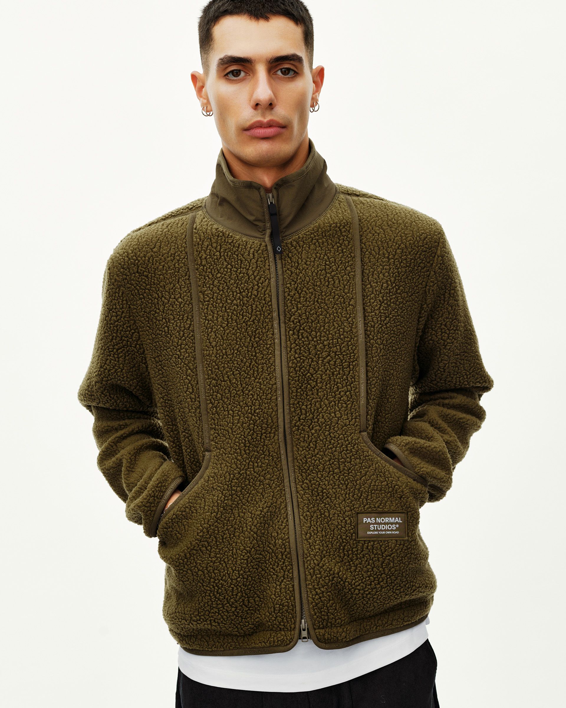 Deep Olive Off-Race Pile Fleece jacket on model, front view with full zip and contrast nylon trim