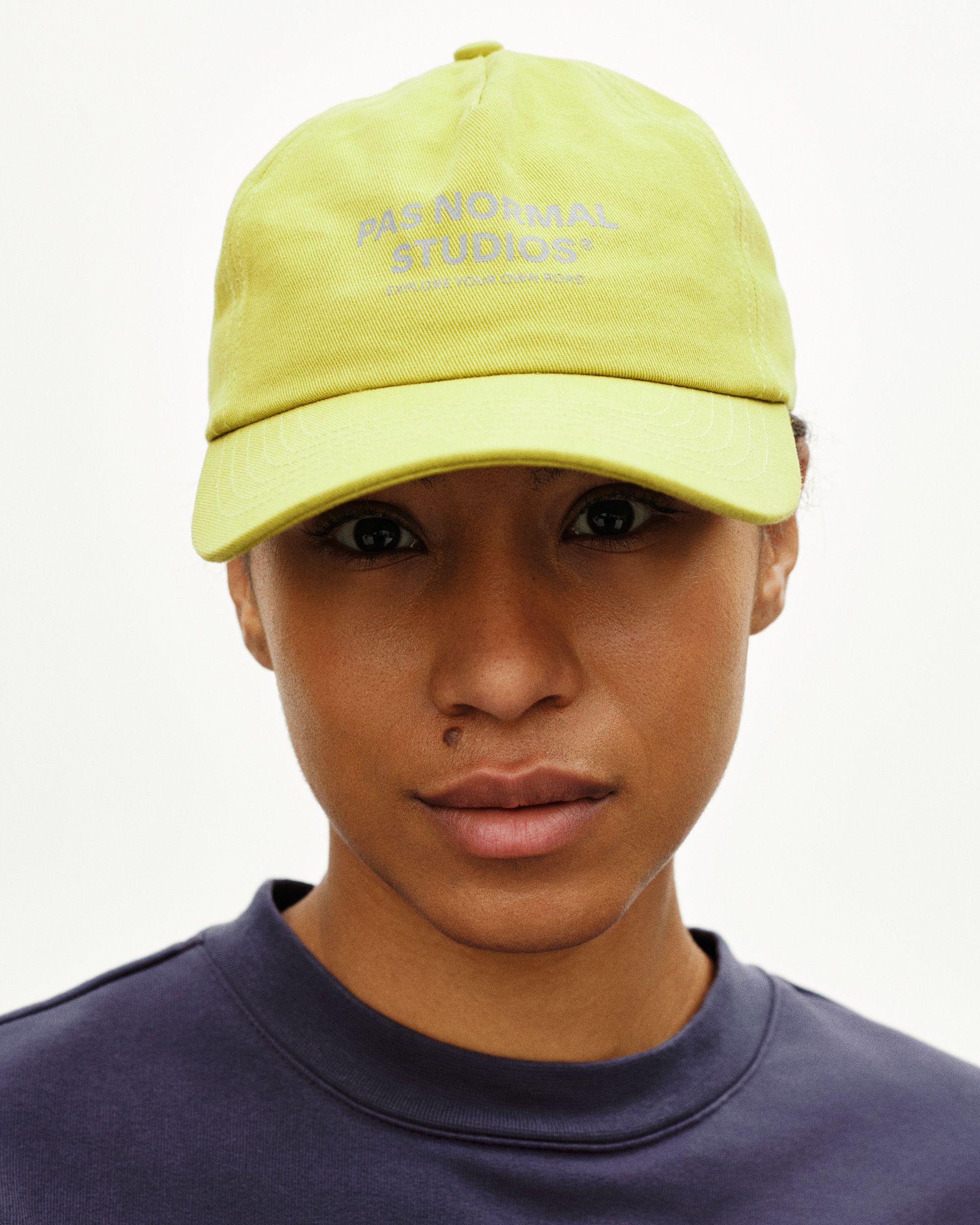 Yellow Off-Race Cotton cap on model with embroidered front logo