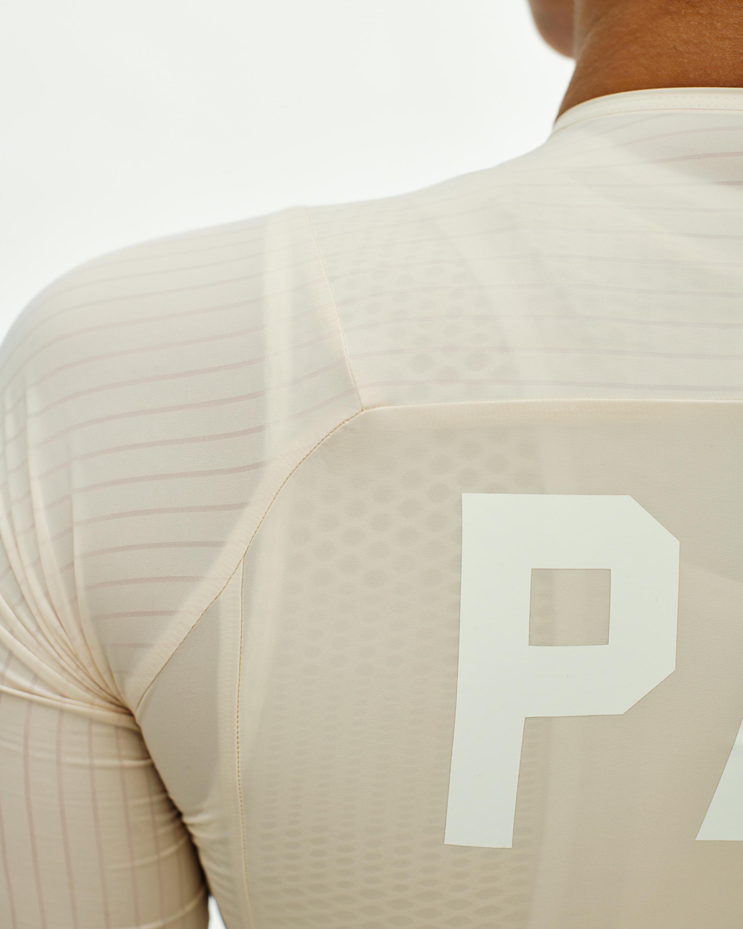 Cream PAS Mechanism Pro cycling jersey, rear three-quarter view with white P logo
