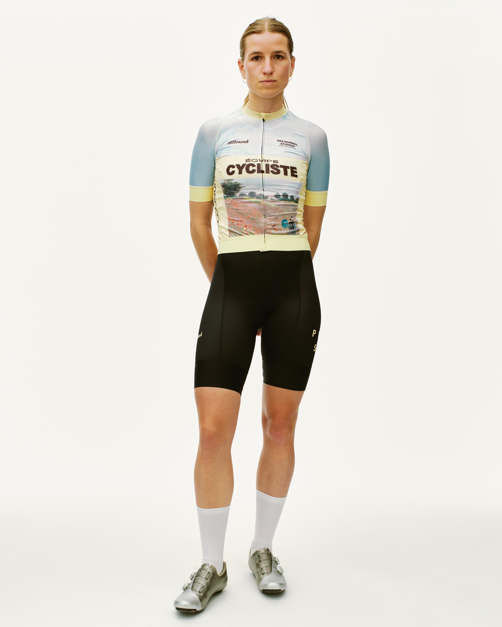 Black JJJJound Mechanism bibs on model with white logo print on leg