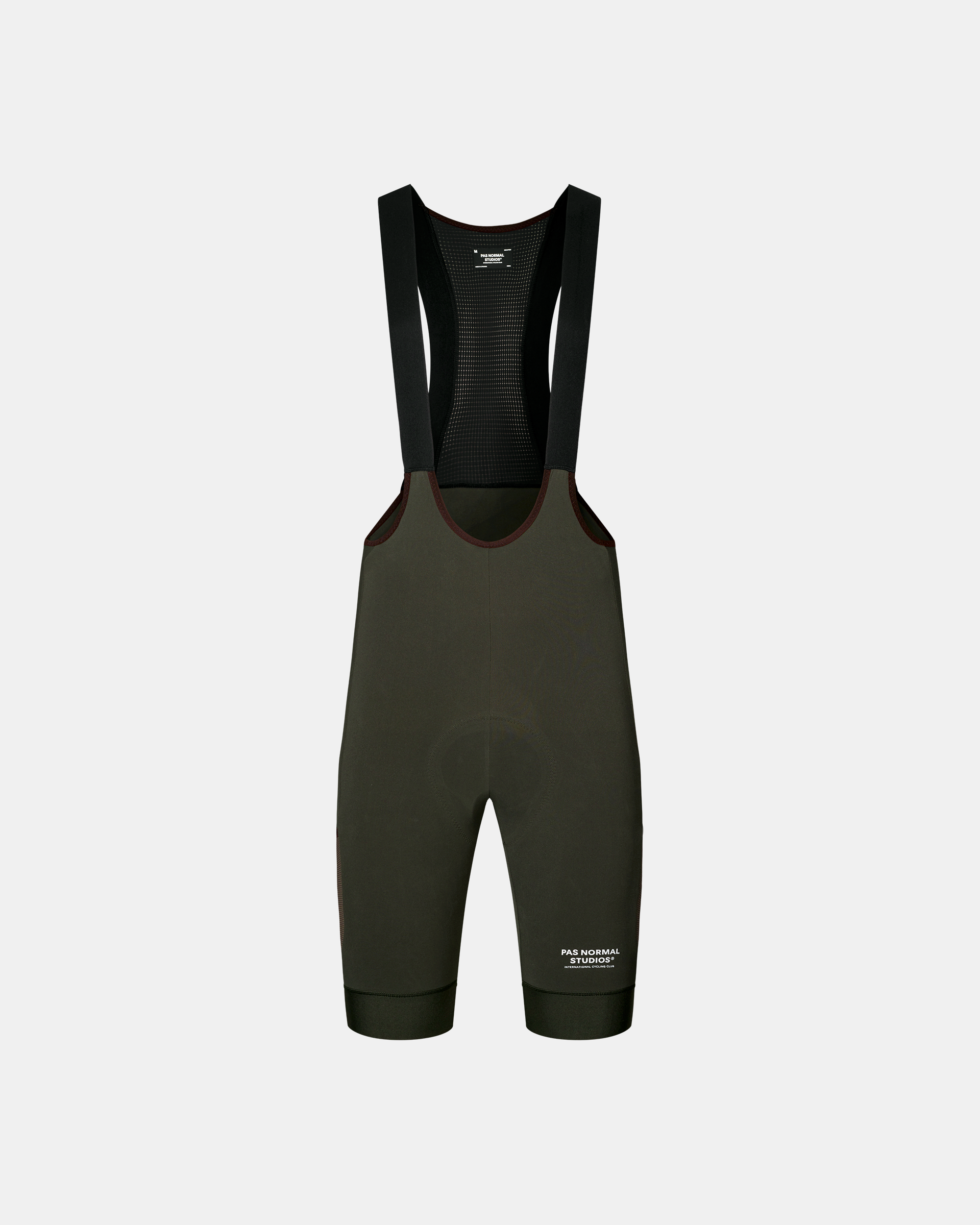 Dark Olive Escapism Cargo cycling bibs, front flat lay with mesh bib panel and contrast trim