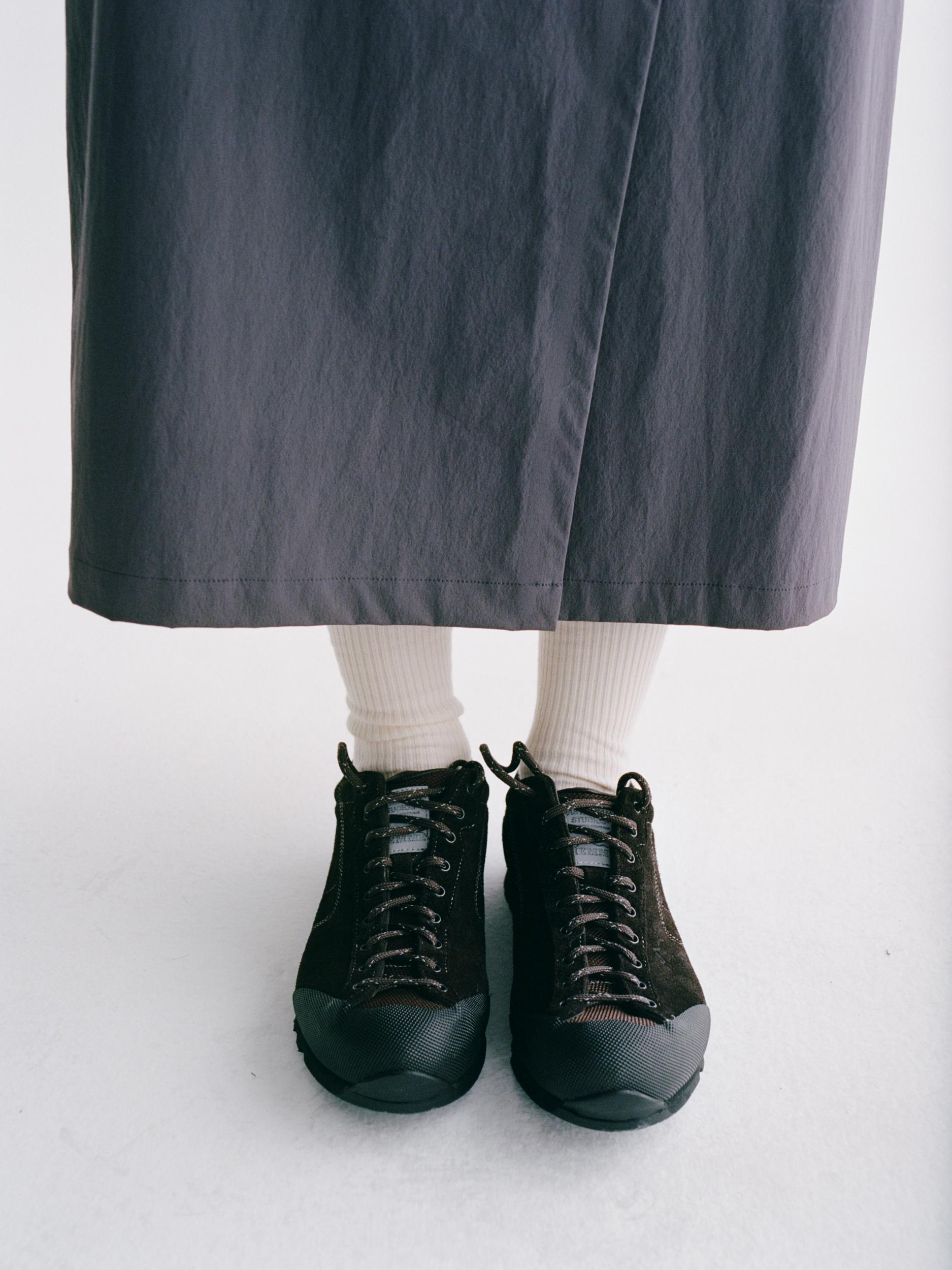 Black Salomon MOVIDA'92 shoes on model with lace-up design and ribbed toe cap