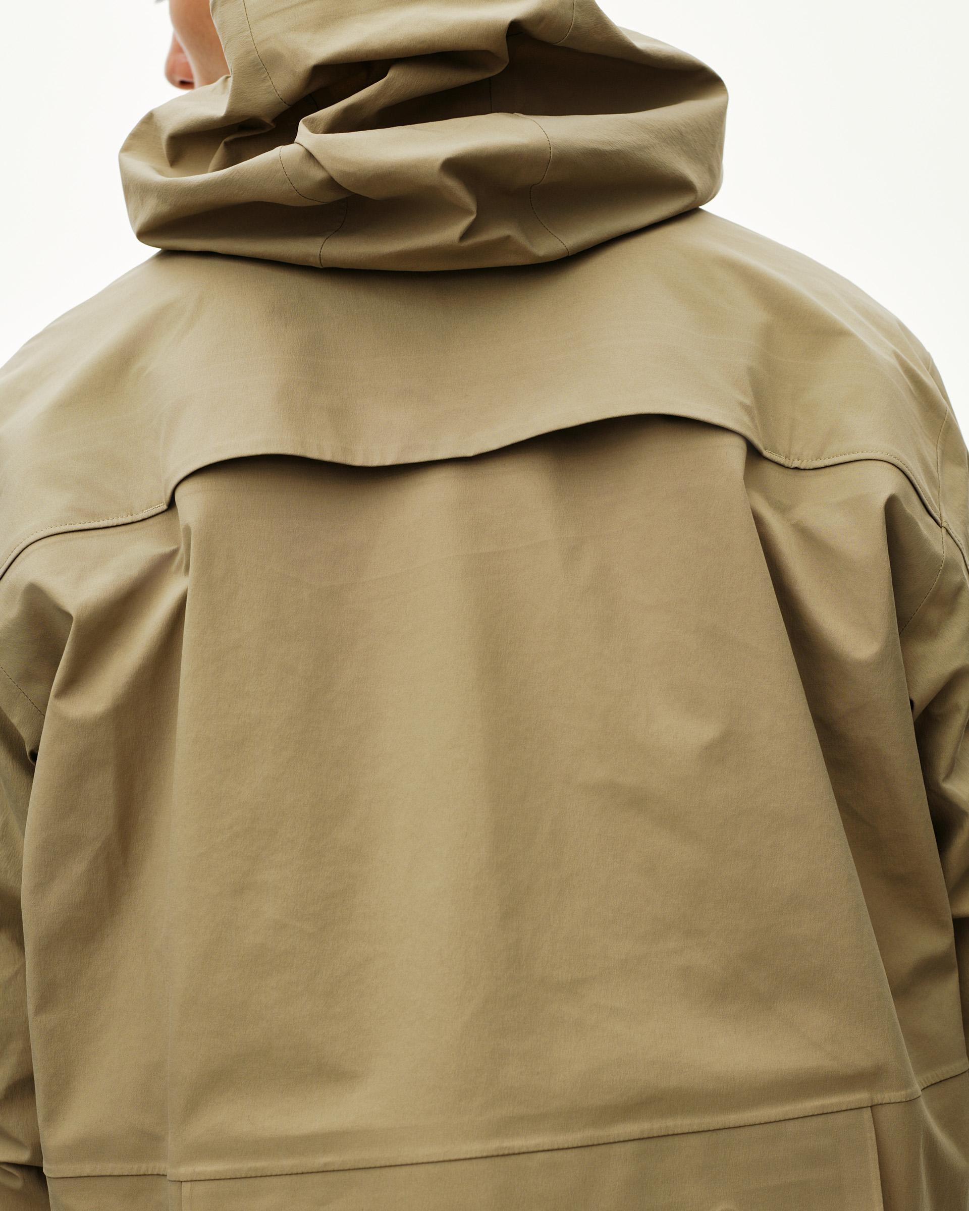 Khaki Green Off-Race 3L Shell jacket, rear view on model with structured hood and back panel seam