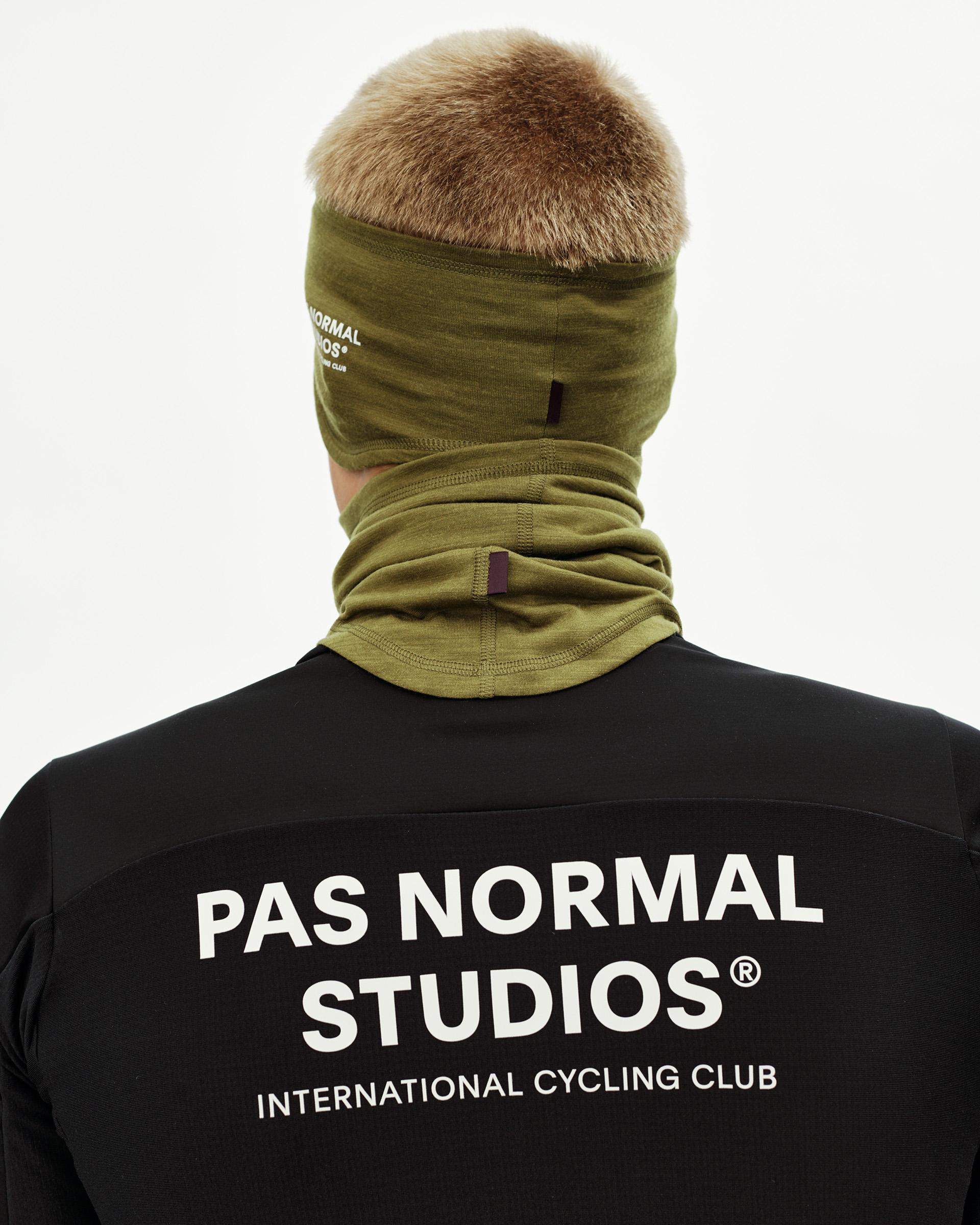 Khaki Green Logo Merino cycling headband on model, rear view worn as balaclava with neck coverage