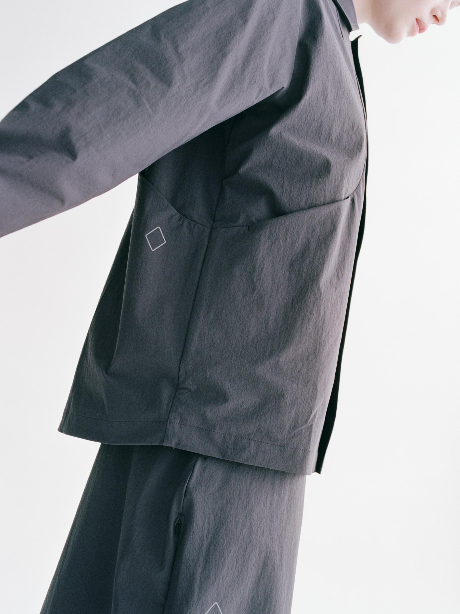 Grey Off-Race Tech Overshirt on model showing chest pocket with logo detail