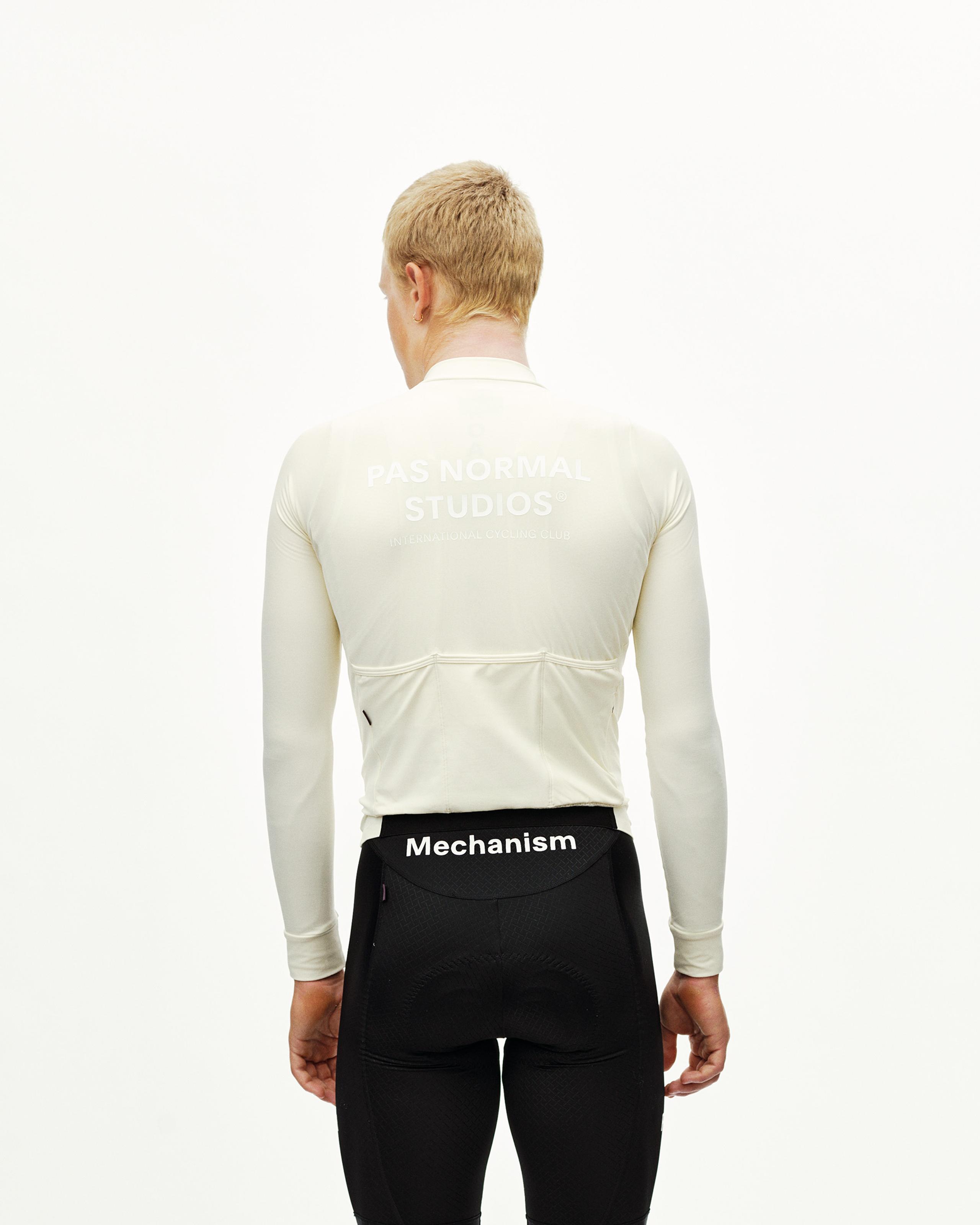 Off White Mechanism long sleeve cycling jersey on model, rear view with back pockets and white chest print