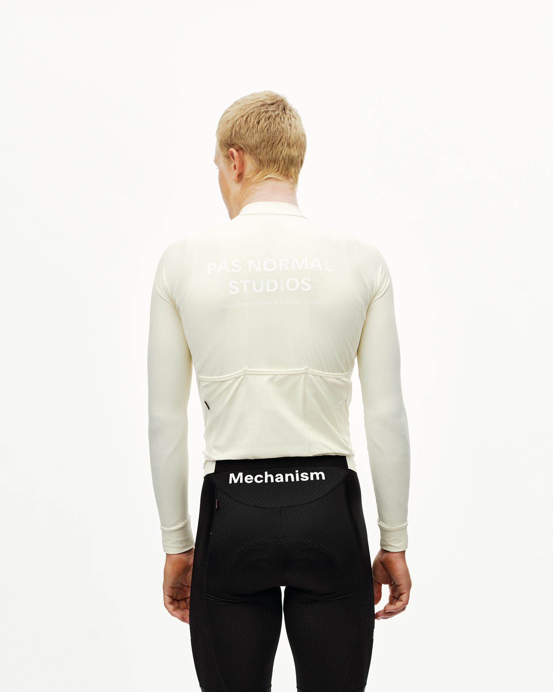 Off White Mechanism long sleeve cycling jersey on model, rear view with back pockets and white chest print
