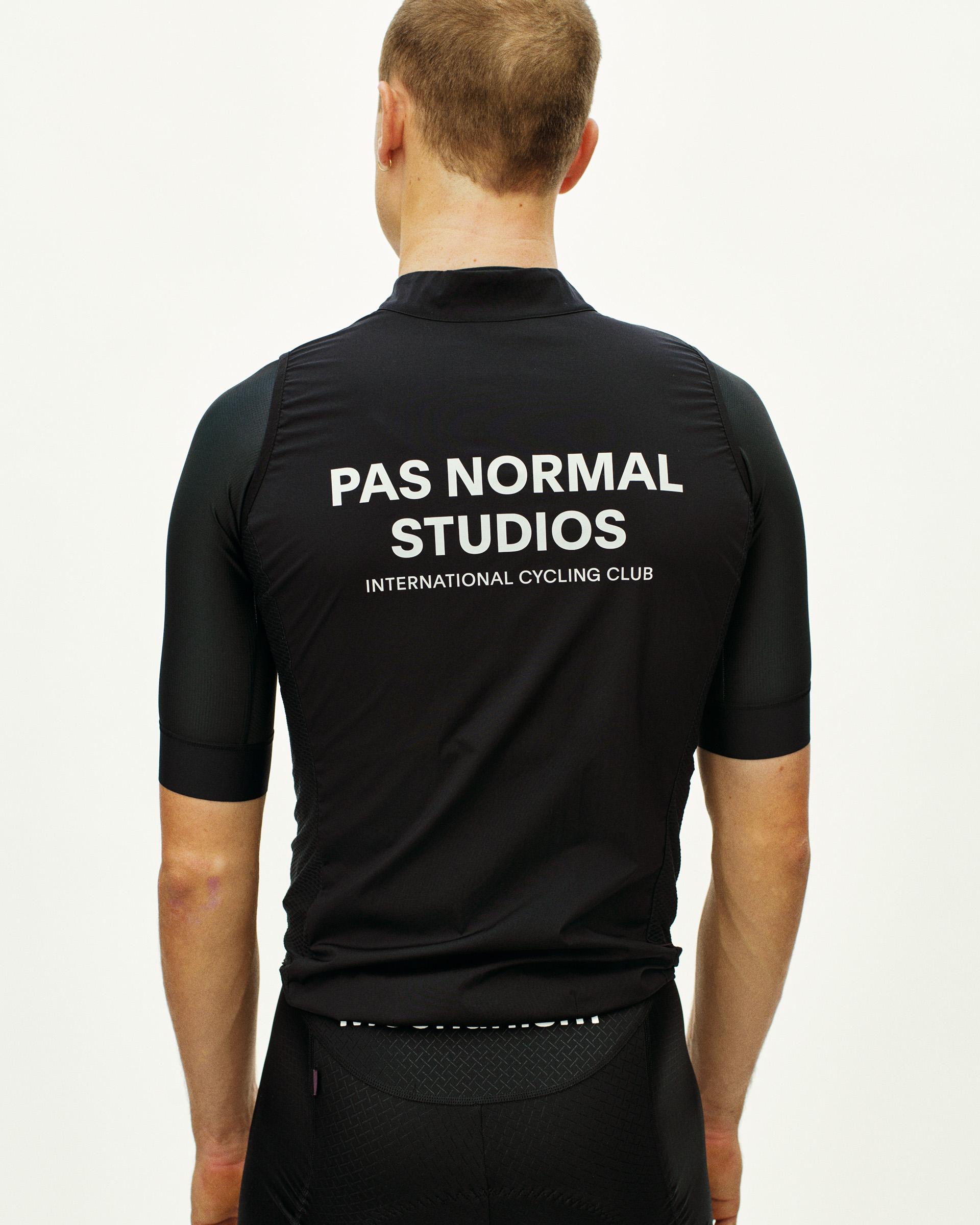 Black Mechanism Stow Away gilet, rear view on model with white back print