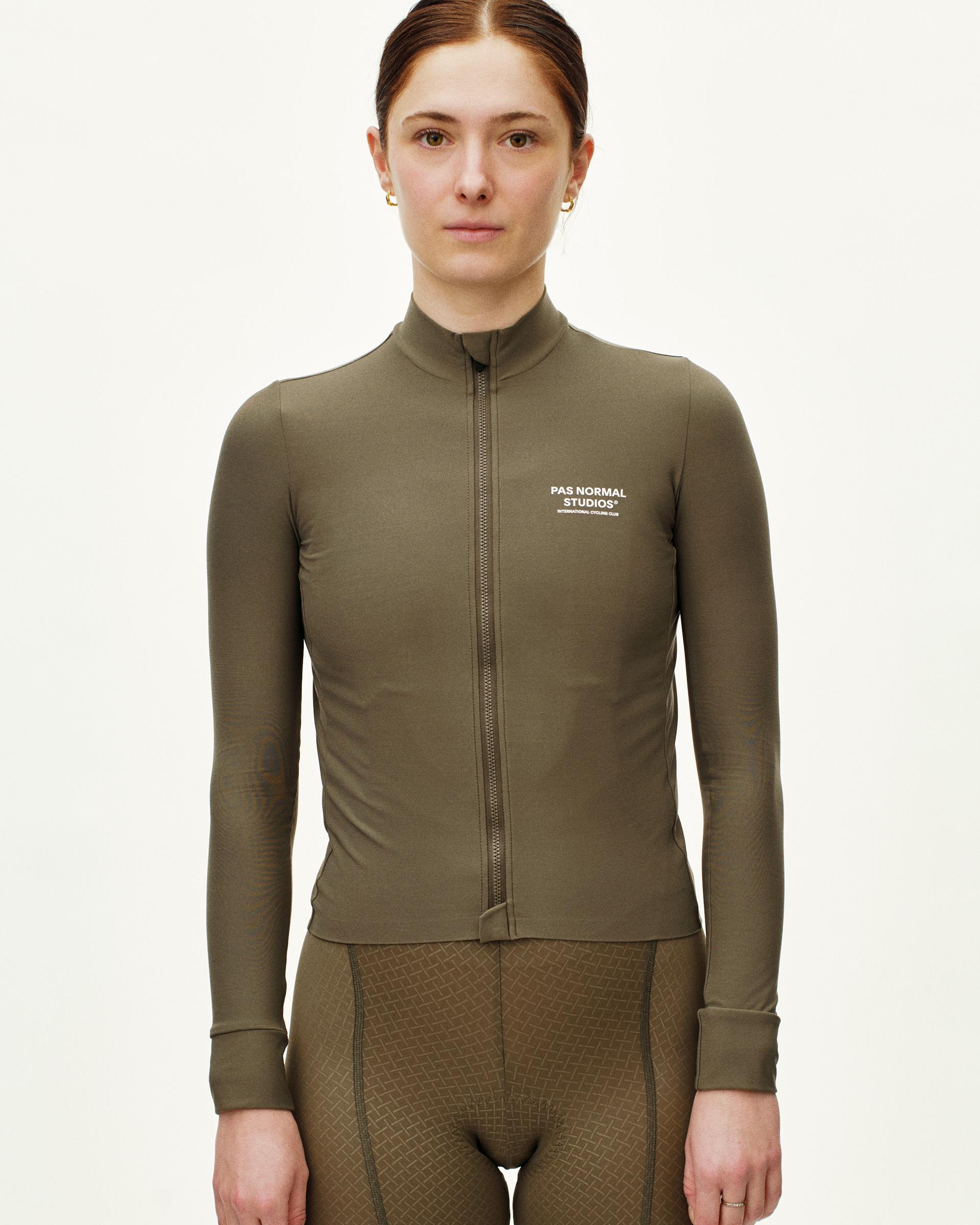 Mud Mechanism long sleeve cycling jersey on model with full zip and white chest logo