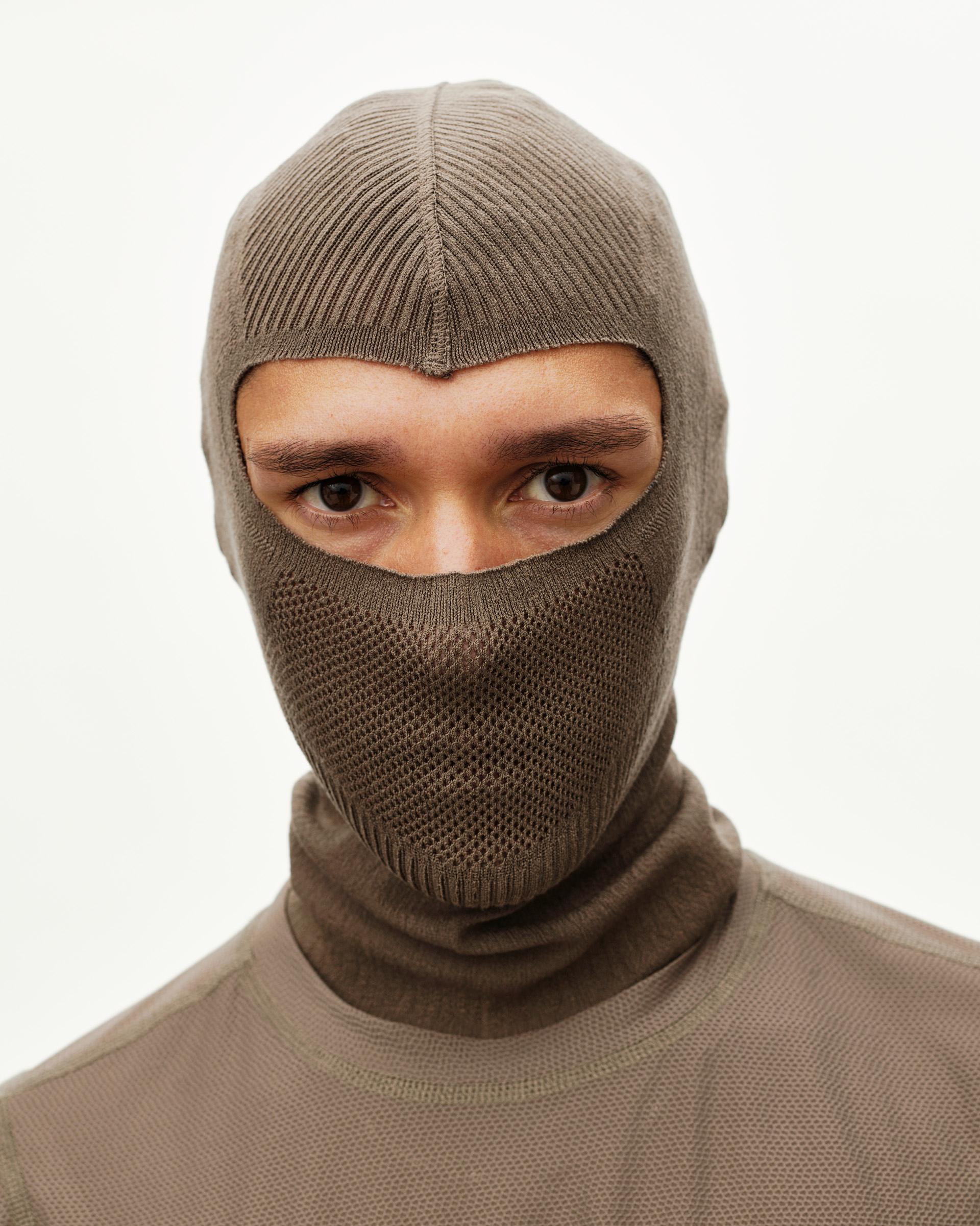 Stone Brown Balance cycling balaclava on model, front view with open eye panel and mesh lower face zone