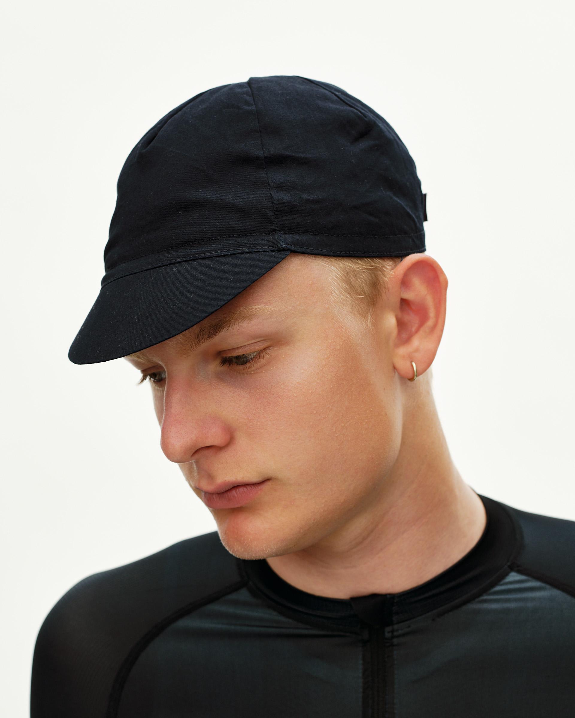 Black Logo Cap cycling cap on model, three-quarter front view with structured brim