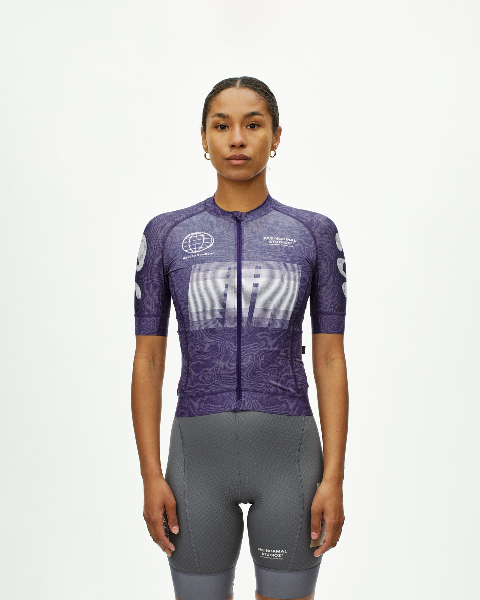 Purple Mechanism women's cycling jersey, front view on model with topo print and large chest graphic