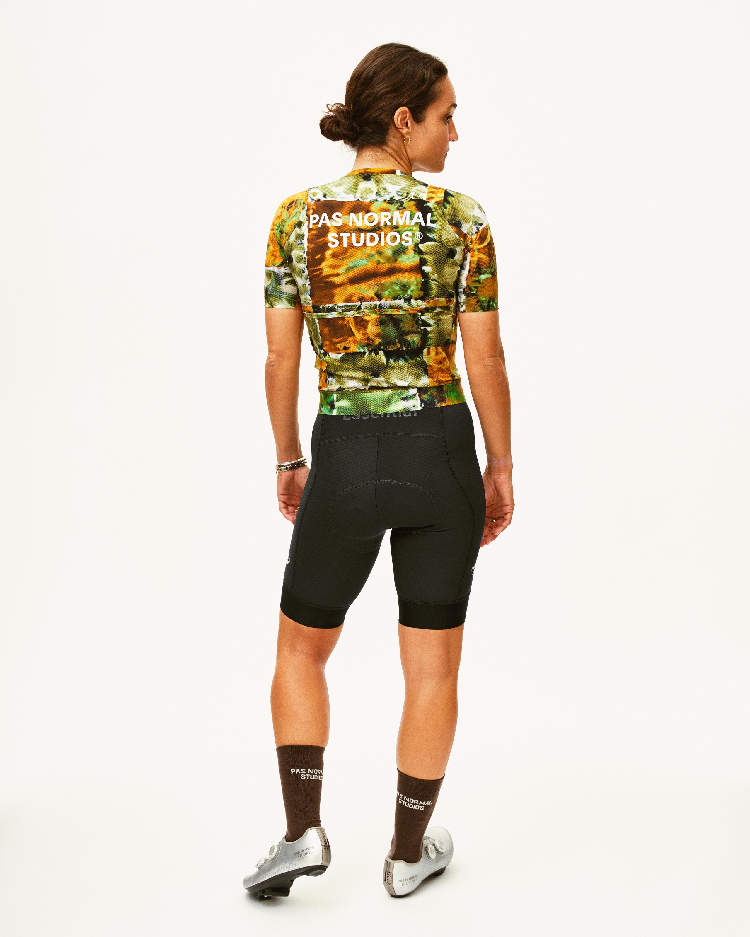 Black Essential bibs on model, rear view with black shorts and floral print jersey
