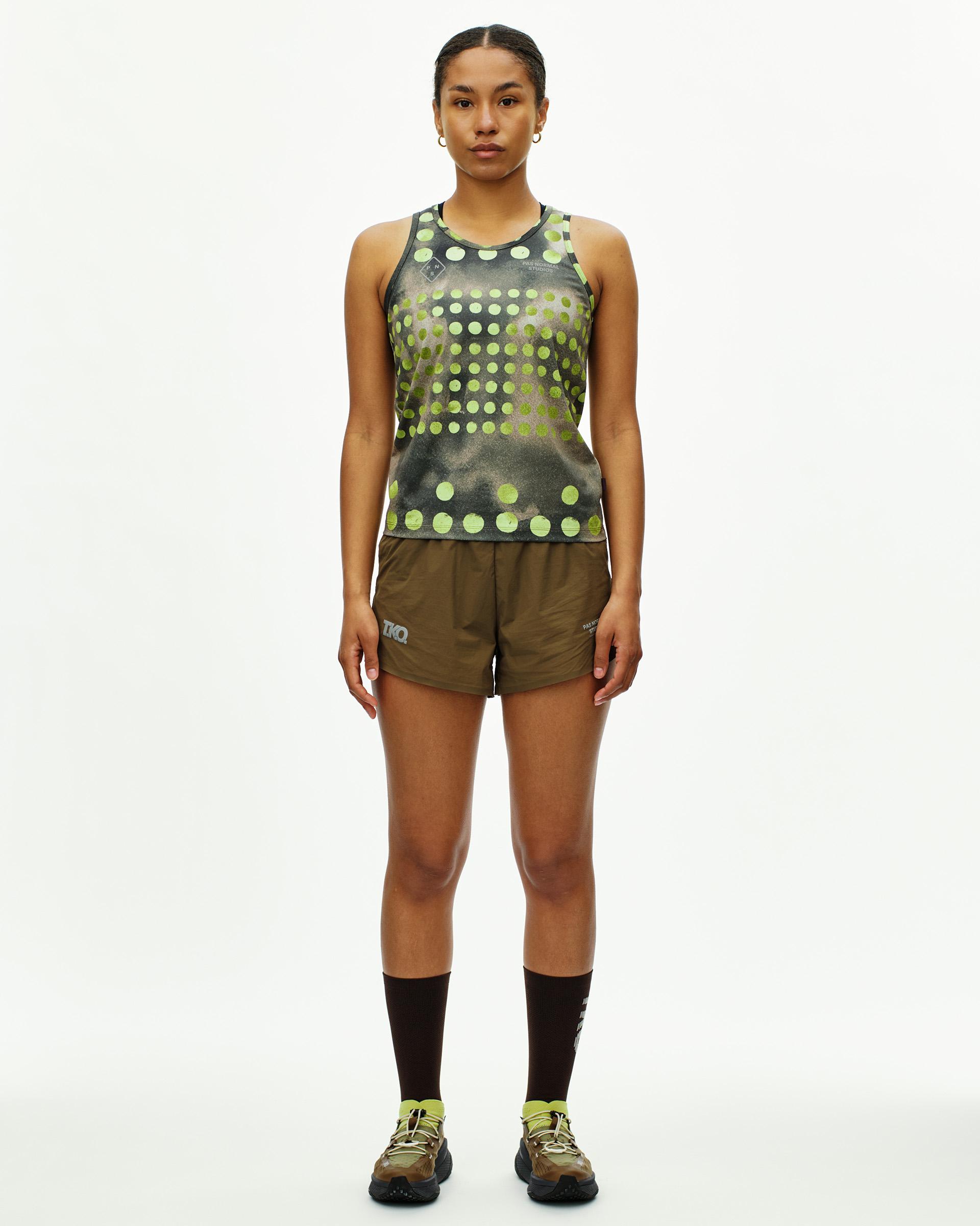 Green T.K.O. Balance singlet on model with gradient polka dot print