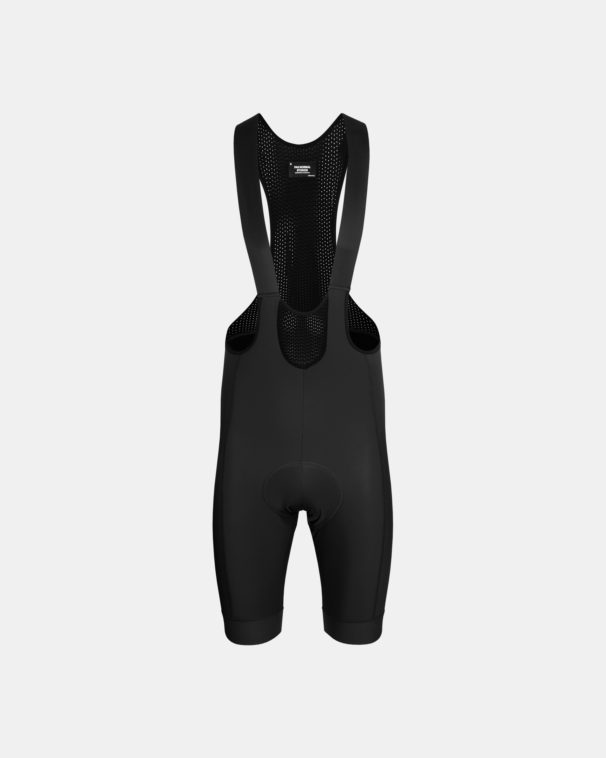 Black Mechanism Deep Winter cycling bibs, front flat lay with perforated mesh bib straps