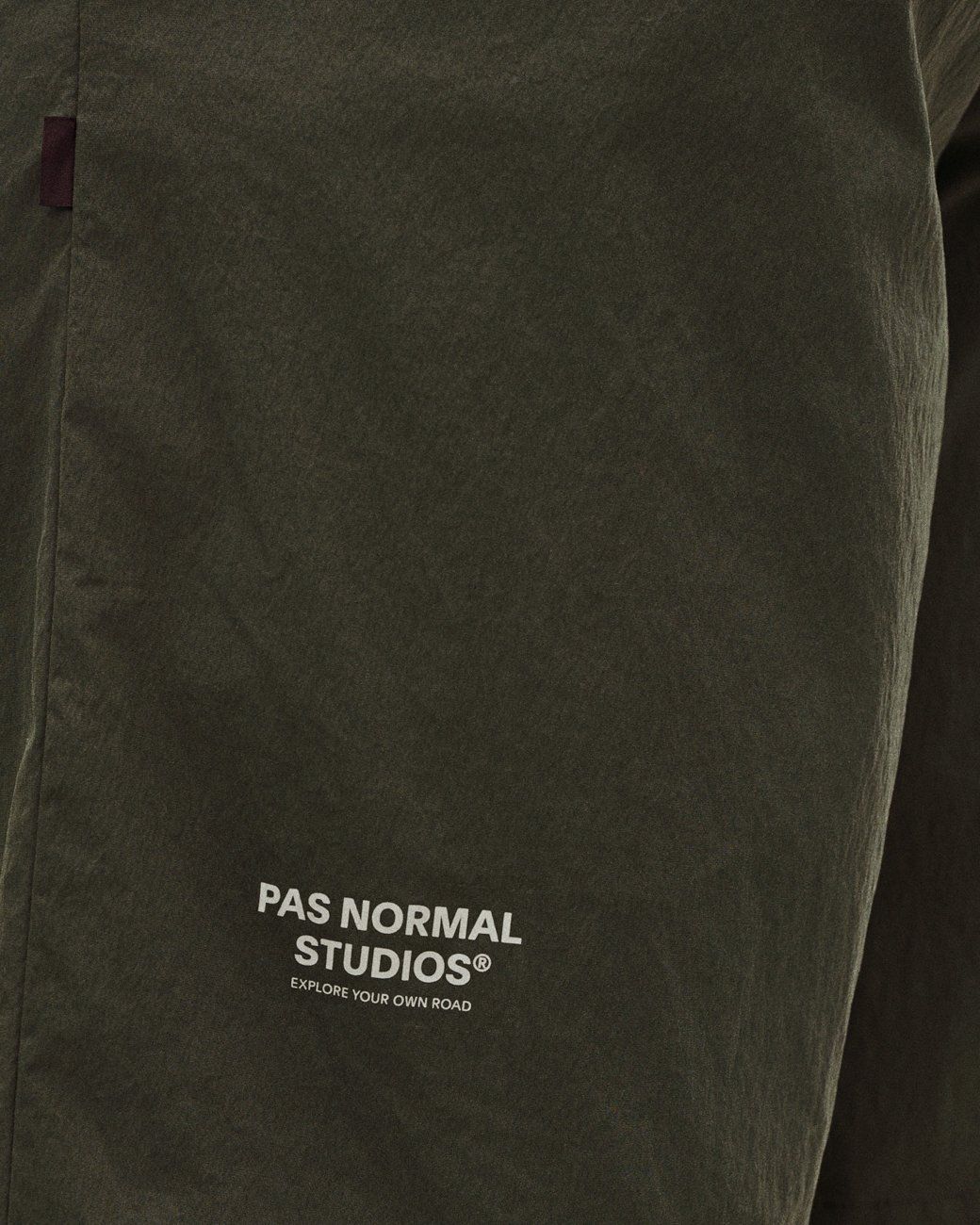 Dark Grey Off-Race Light Tech shorts, side detail view with white logo print