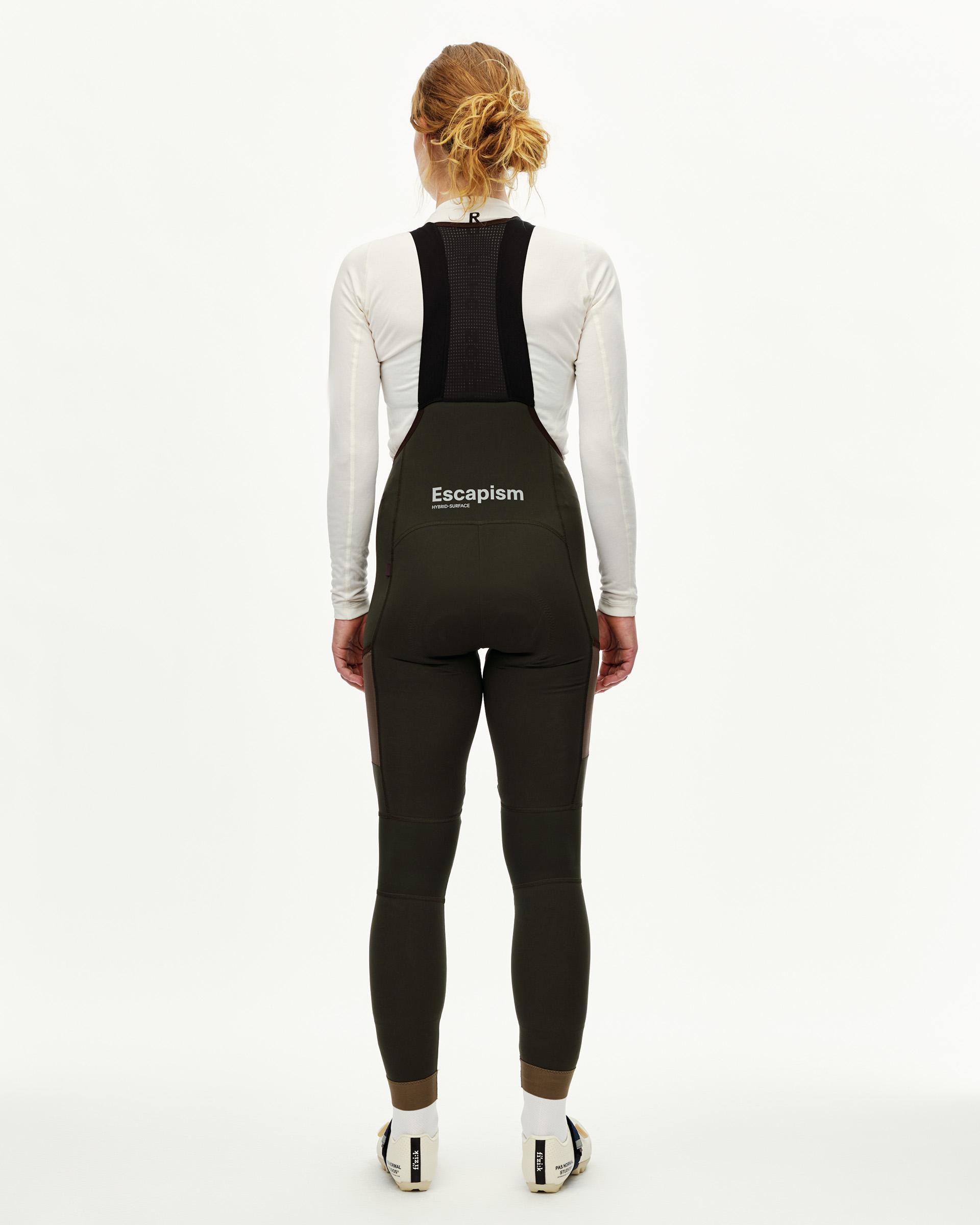Dark Olive Escapism Long Cargo cycling bibs on model, rear view with mesh back strap and contrast panel
