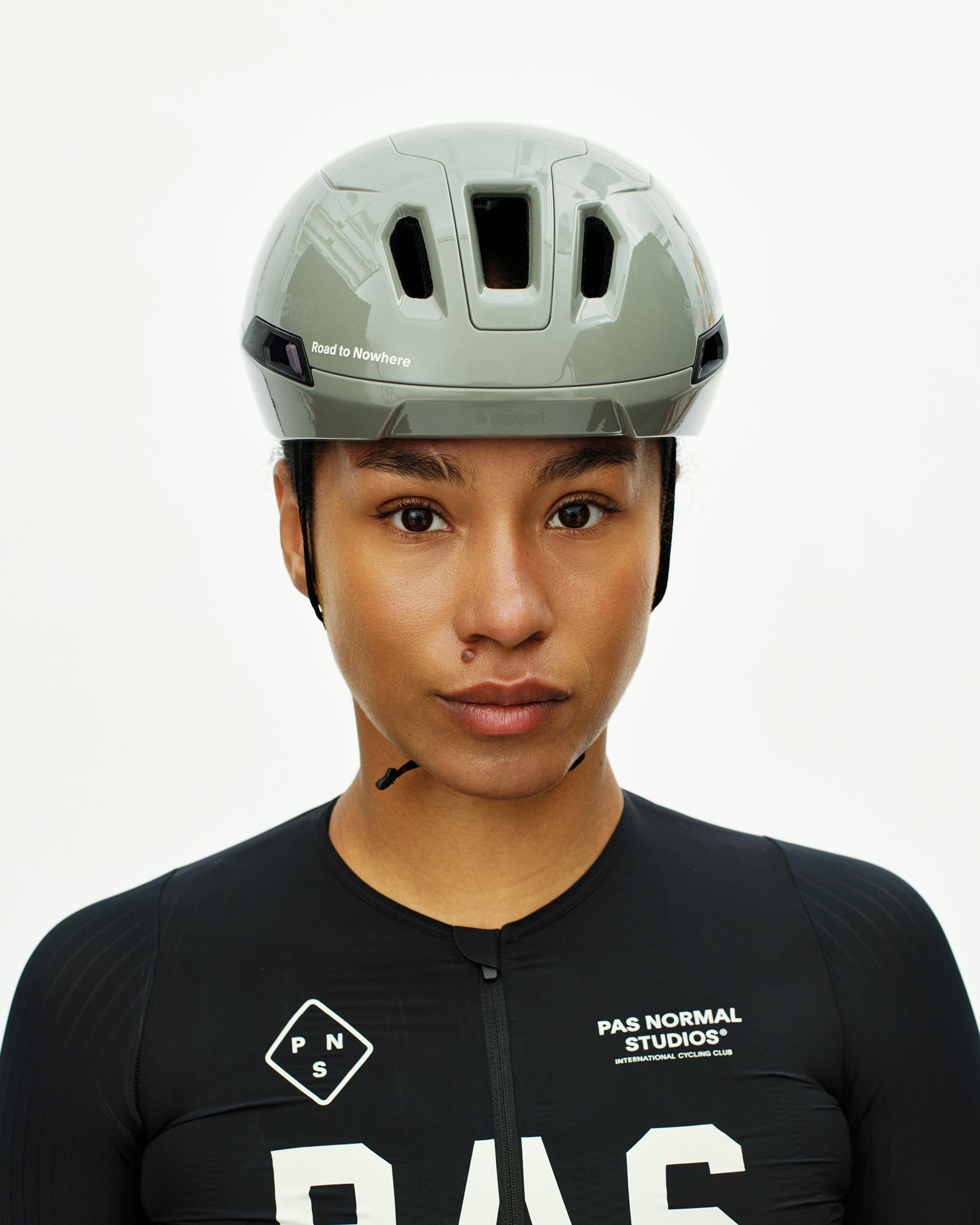 Grey PAS Tucker III 2Vi MIPS cycling helmet on model with Road to Nowhere text and ventilation ports