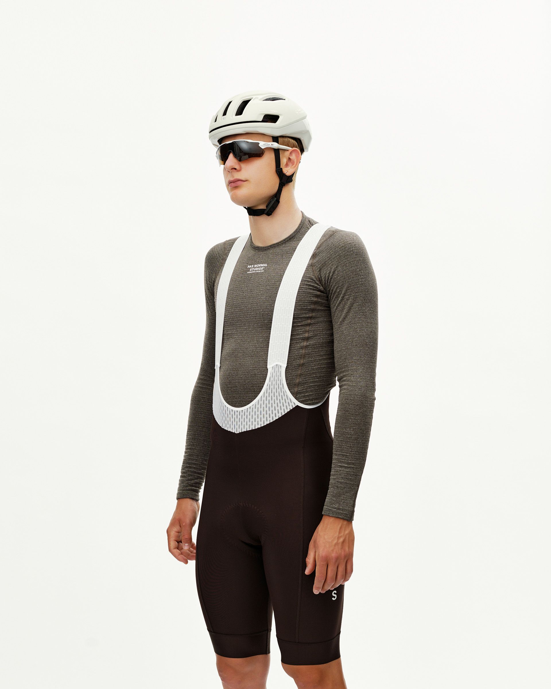 Dark Coffee brown Mechanism Thermal cycling bibs on model, front view with white bib straps