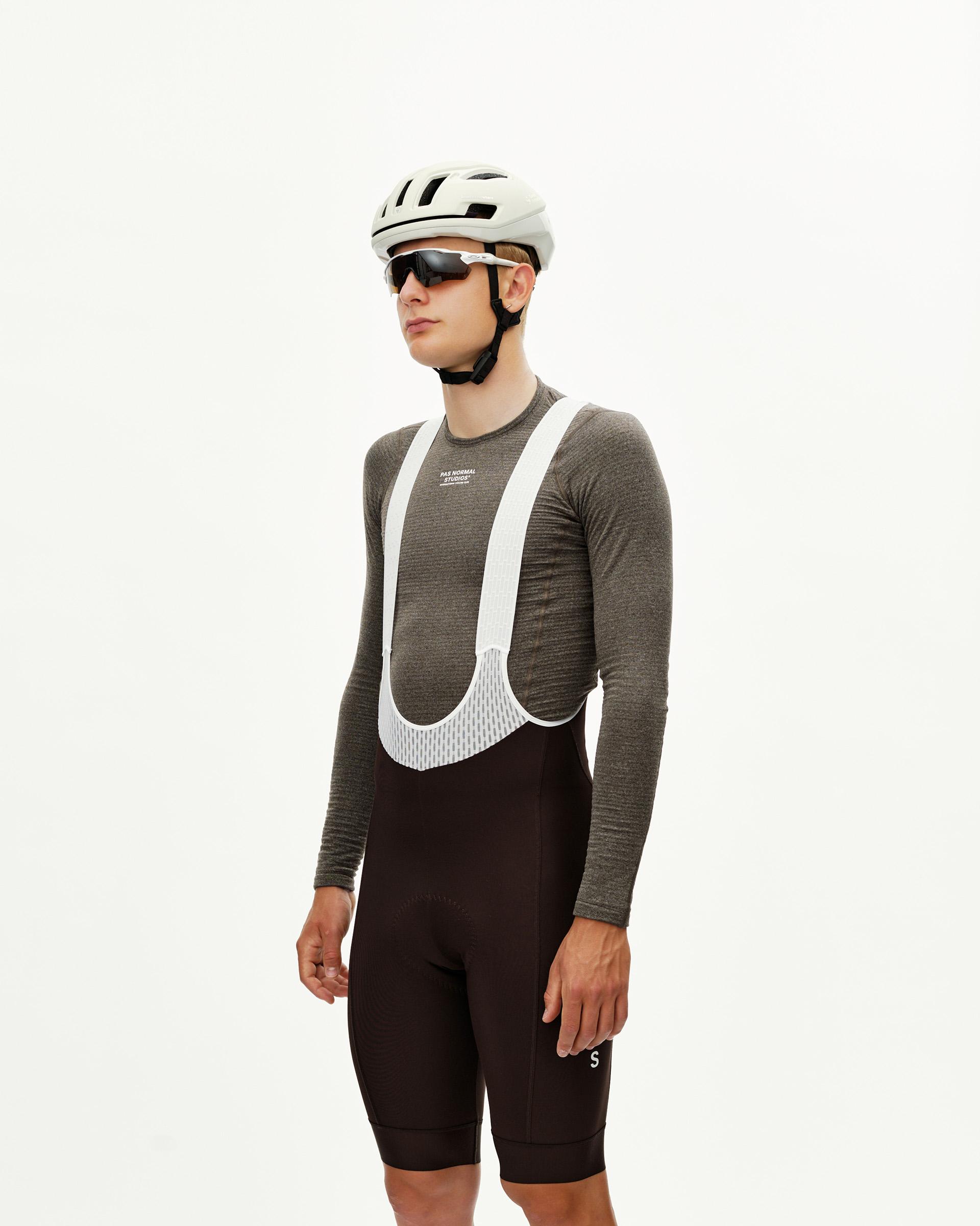 Dark Coffee brown Mechanism Thermal cycling bibs on model, front view with white bib straps