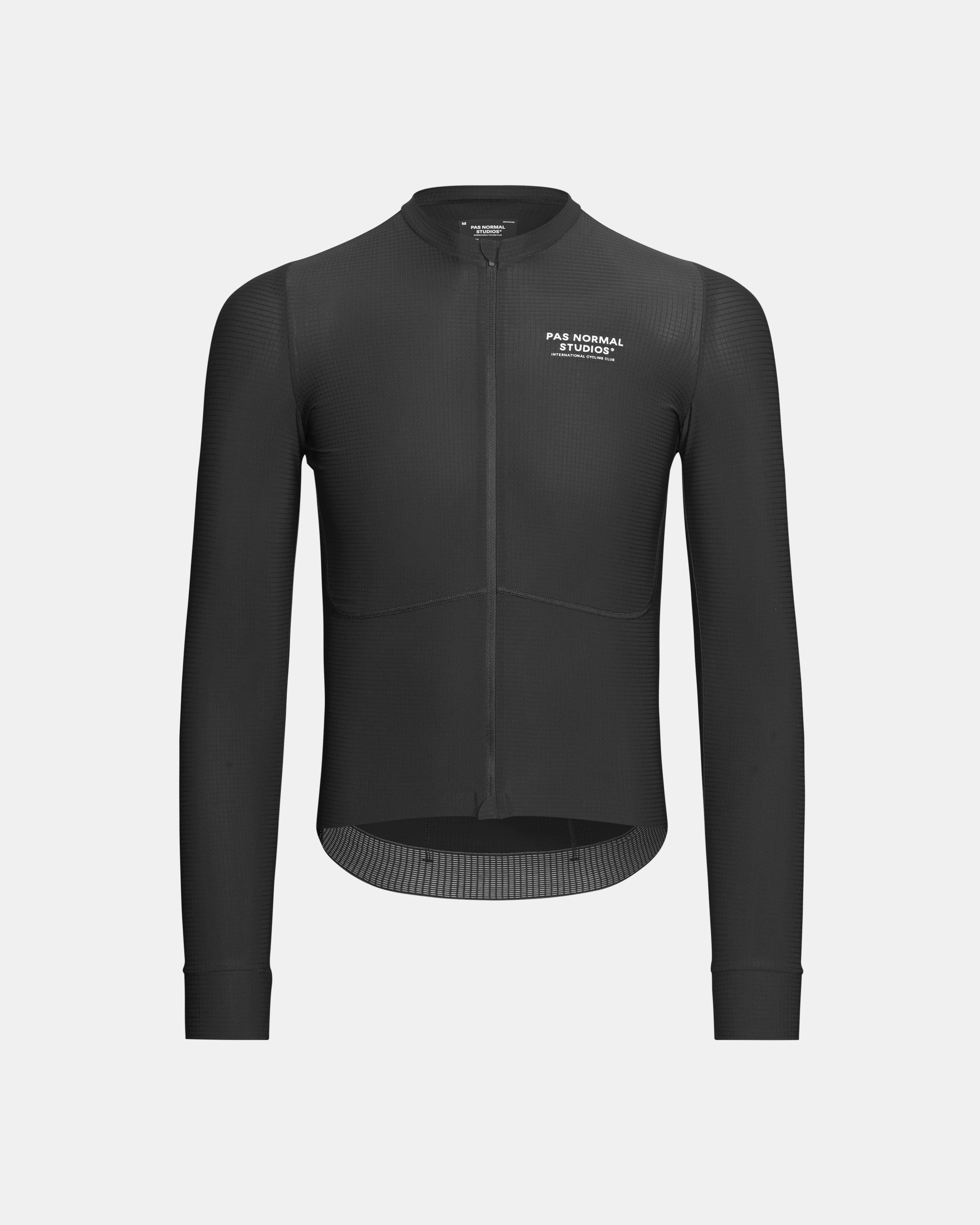 Black Mechanism Pro long sleeve cycling jersey, front view with textured fabric and chest logo