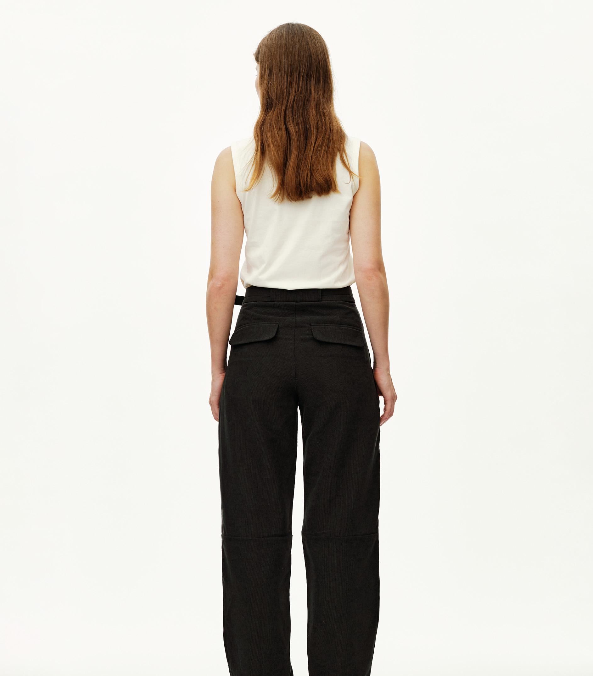 Black Off-Race Corduroy pants on model, rear view with wide leg and back patch pockets