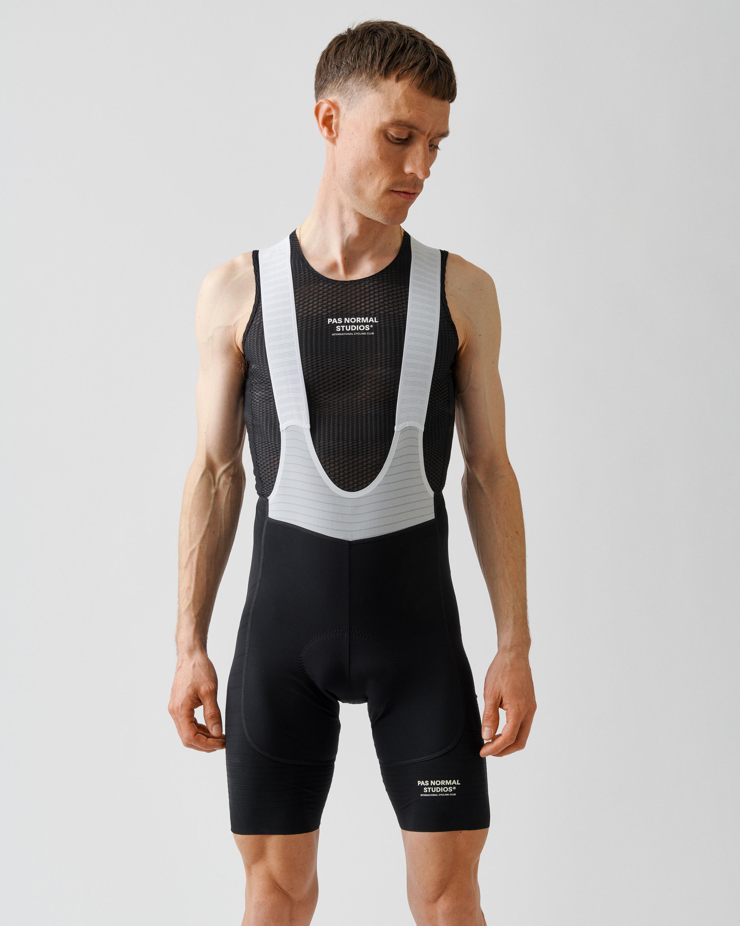 Black Mechanism Pro sleeveless base layer on model with mesh front panel