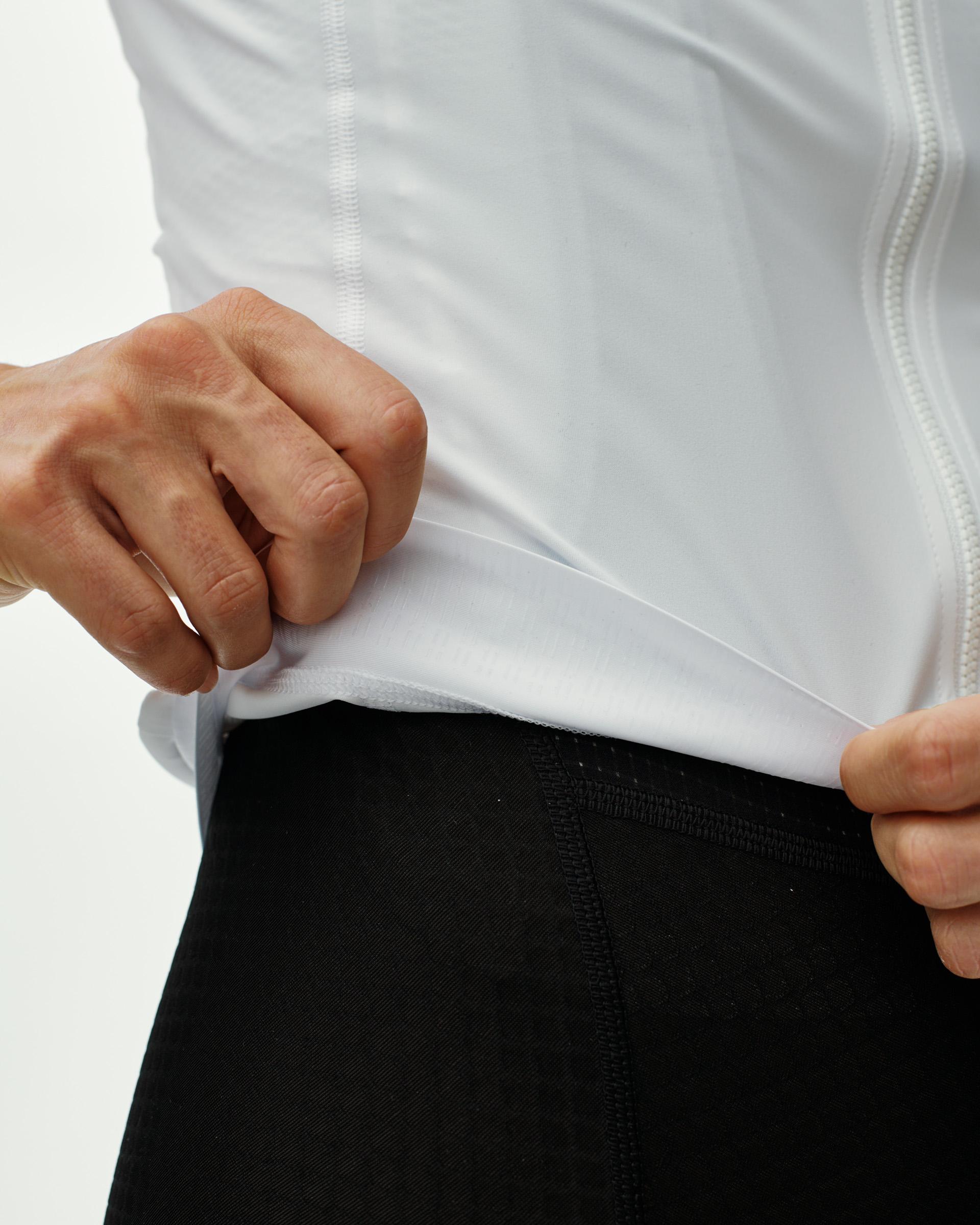 White Essential cycling jersey on model showing relaxed fit and side seam detail