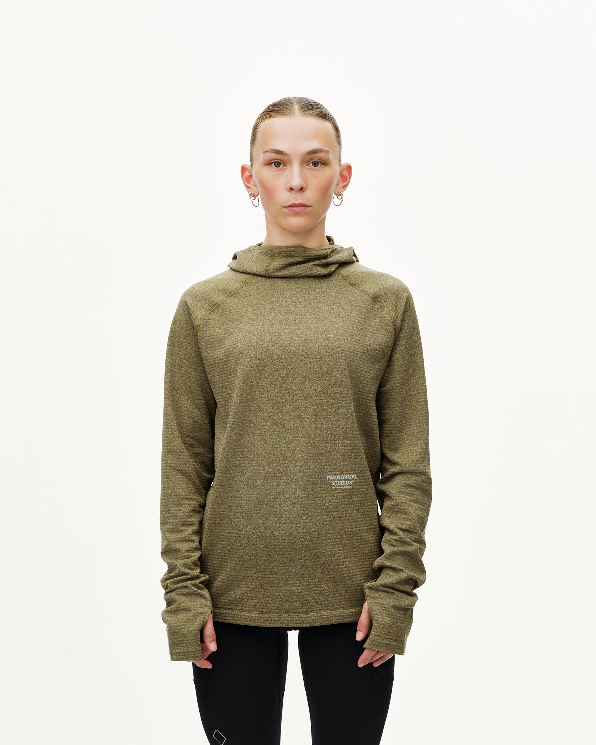 Moss Brown Balance Thermal cycling hoodie on model, front view with hood and thumbhole cuffs
