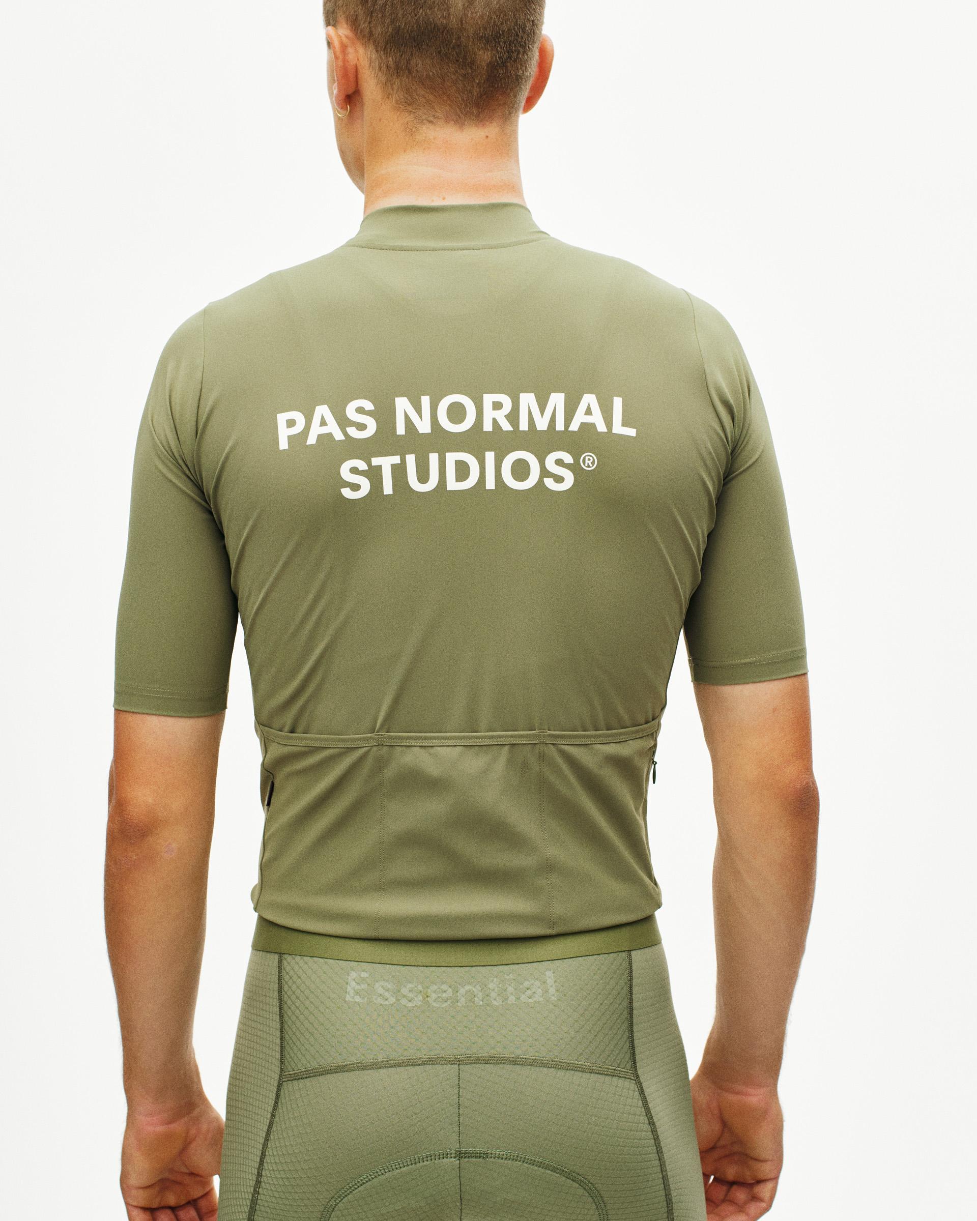 Light Olive Essential cycling jersey, rear view on model with white back print