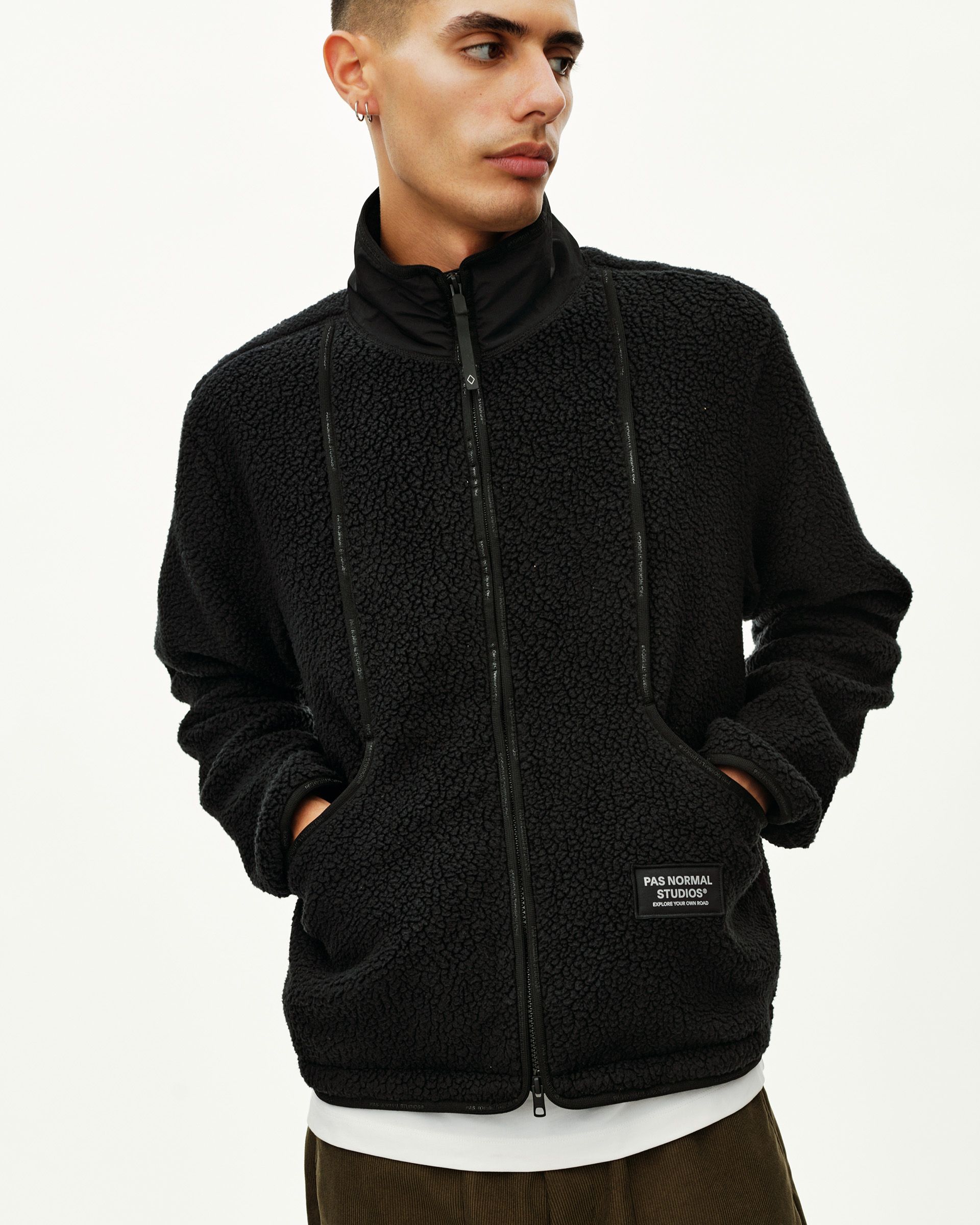 Black Off-Race Pile Fleece jacket on model, front view with full zip and sherpa texture