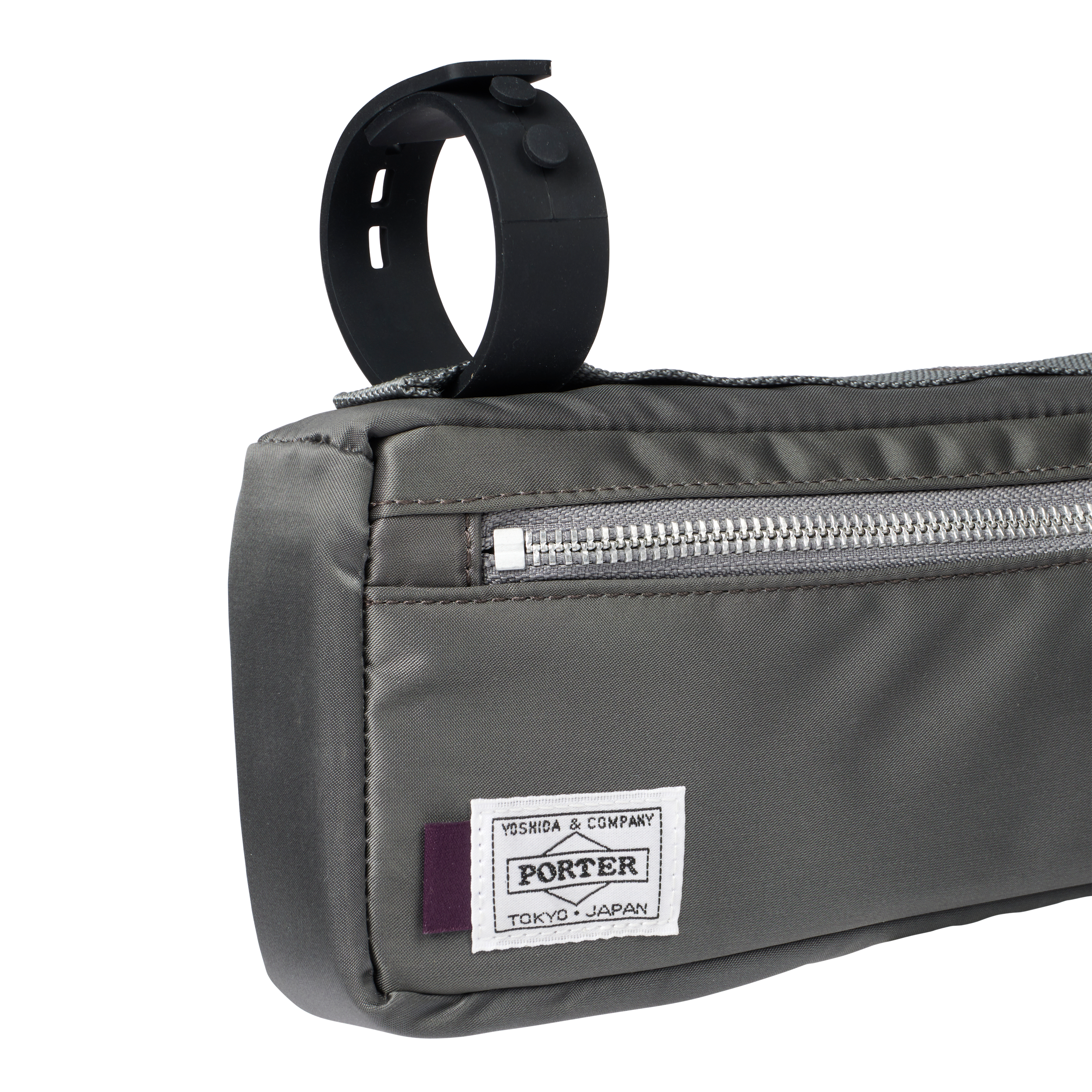 Grey Porter-Yoshida frame bag, detail view showing silver zip and woven Porter logo patch