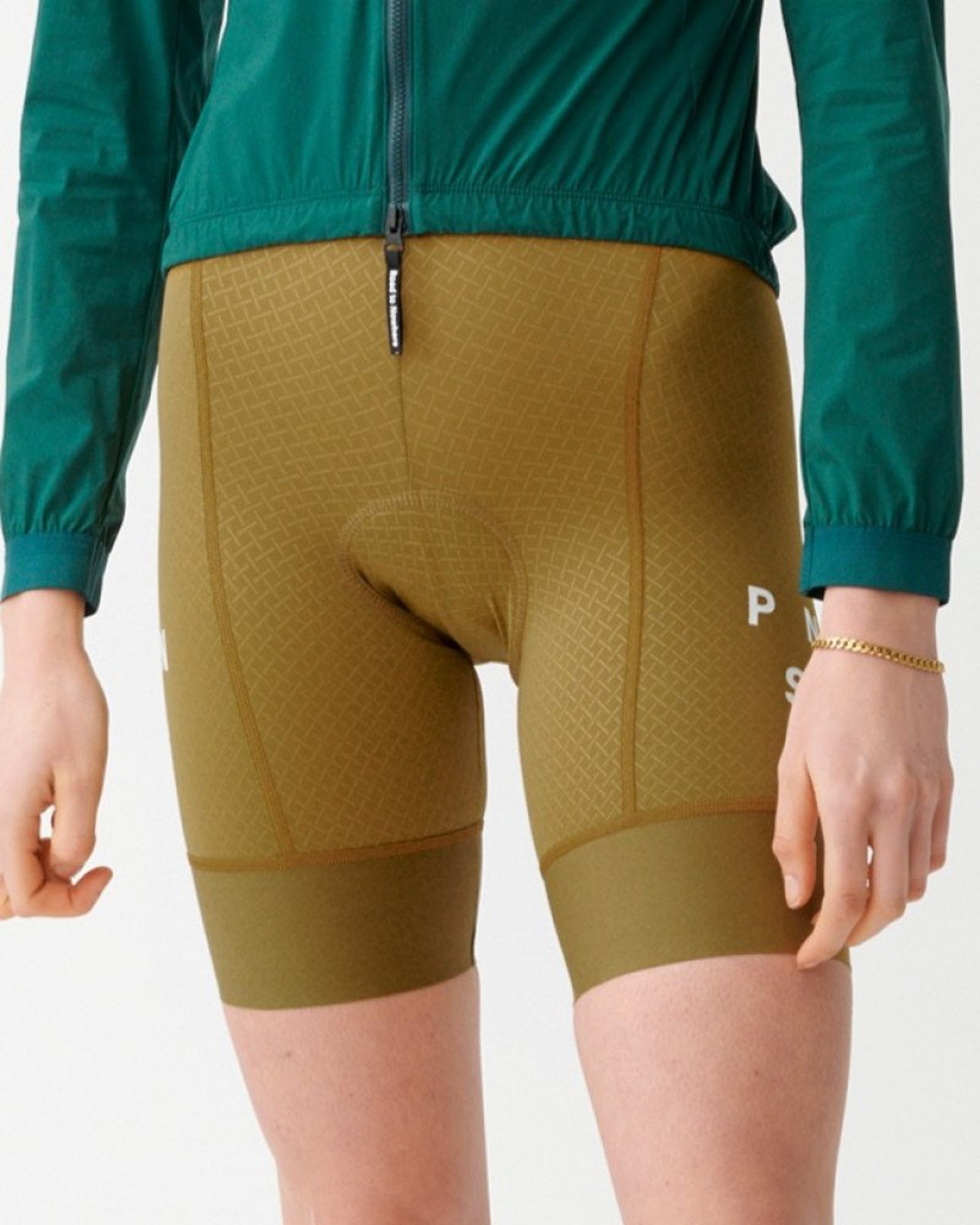 Brown Mechanism bibs on model with textured fabric panels
